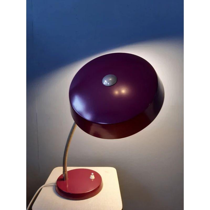 Very rare space age desk lamp by Philips in purple colour. The colour of the lamp looks slightly pink on the pictures, but is quite clearly (dark) purple in real life. The metal shade can be easily adjusted with the flexible arm. The lamp requires a