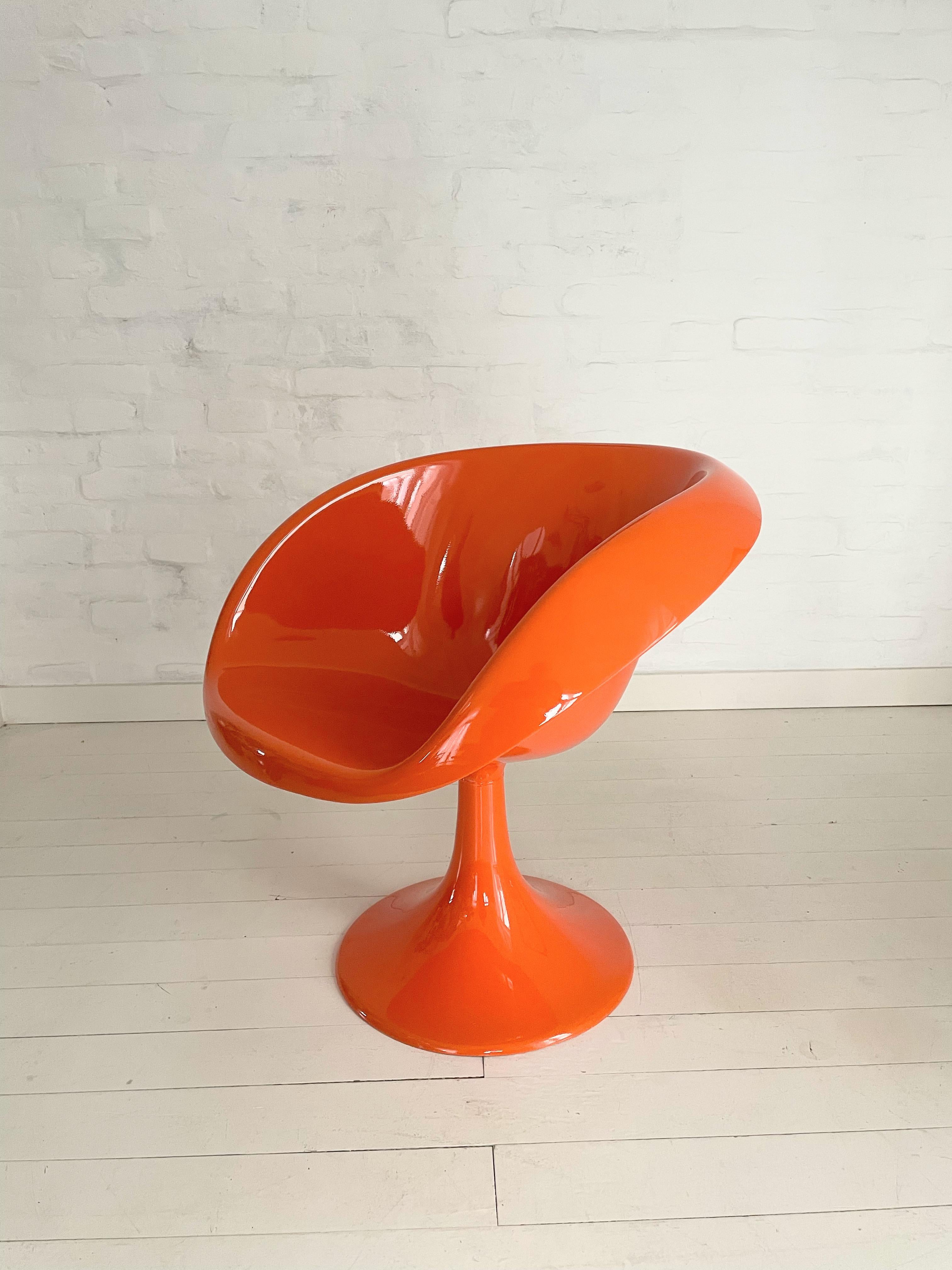 A stunning 1970s molded fiberglass comfortable armchair. In refurbished condition. This Orange-colored Space Age design furniture is made of fiberglass resin, . Made in limited quantities. .Extremely nice condition, even for a collection. The