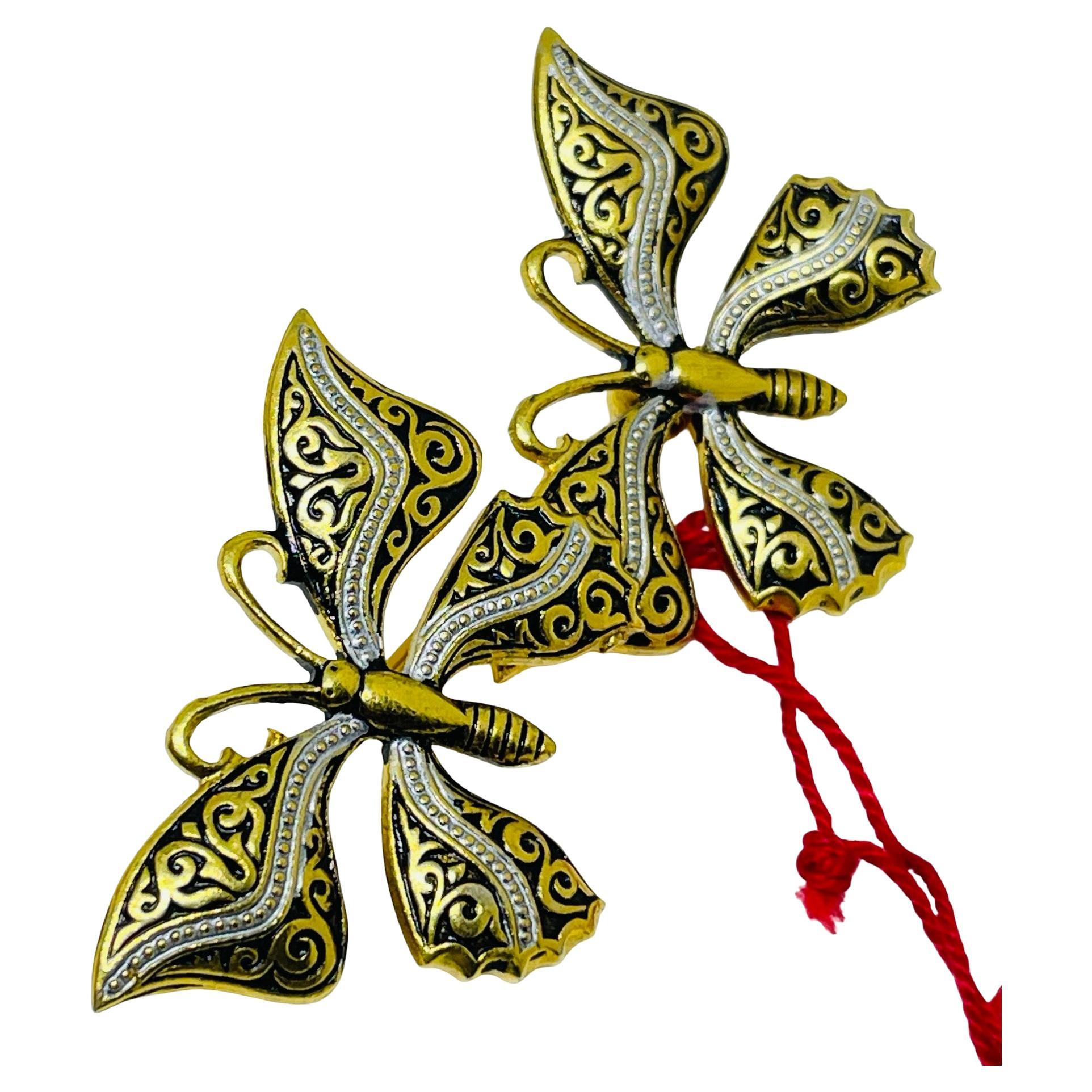 Broche vintage d
Espagne damasquinée, ton or, papillon noir.