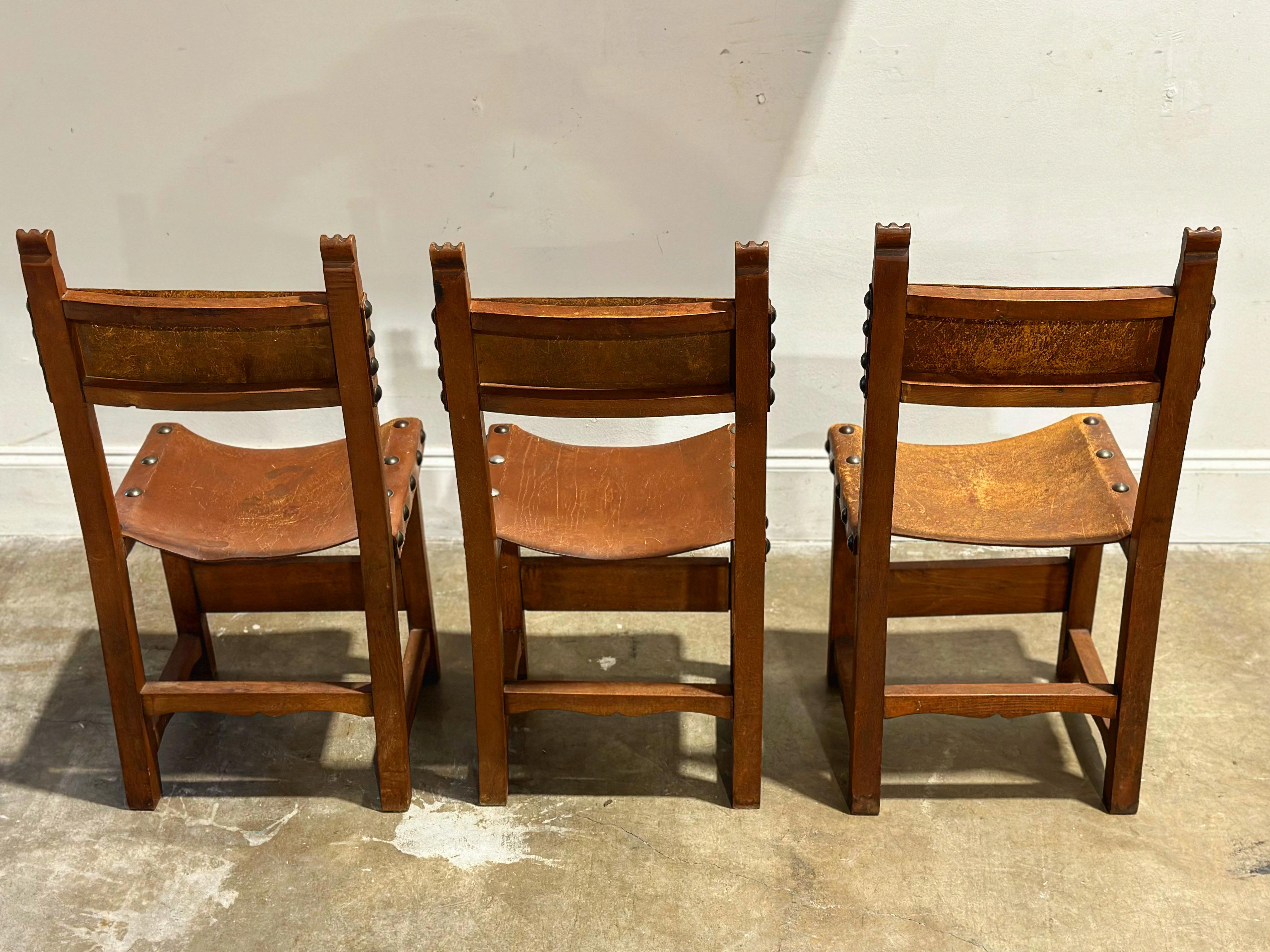 Mid-20th Century Vintage Spainish Revival Carved Oak + Leather Dining Chairs - Set of Six For Sale