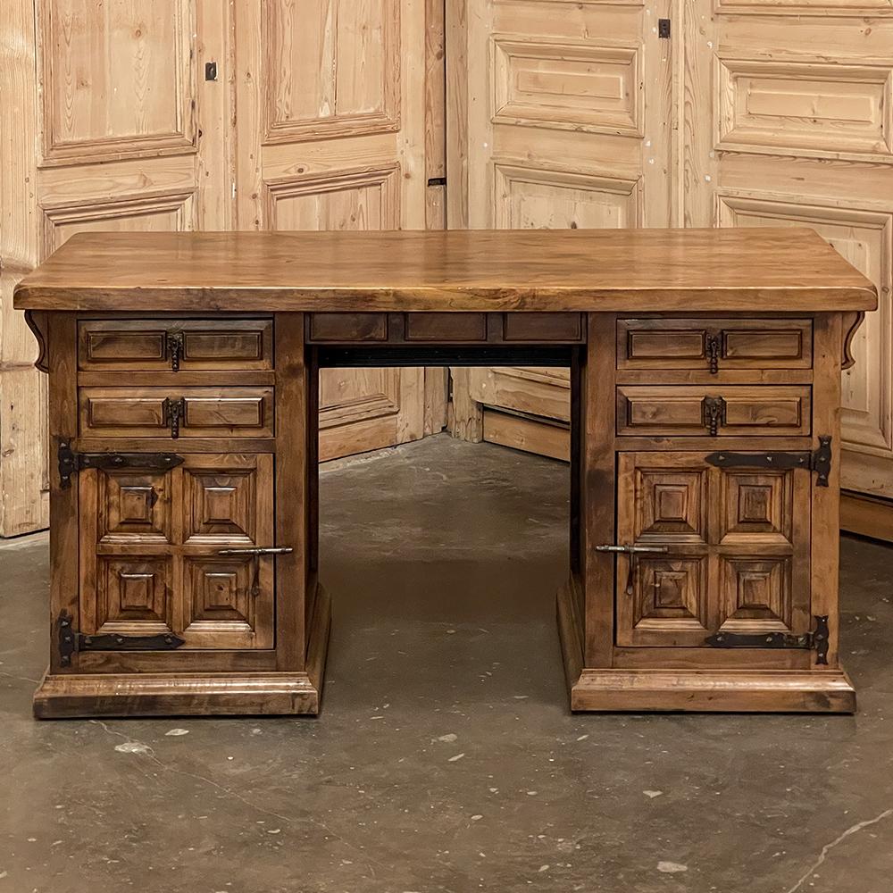Vintage Spanish Colonial desk was designed to follow the style dictates that date back centuries on the Iberian Peninsula! Using thick planks of old-growth yellow pine, the artisans created a multitude of raised, chamfered panels which were
