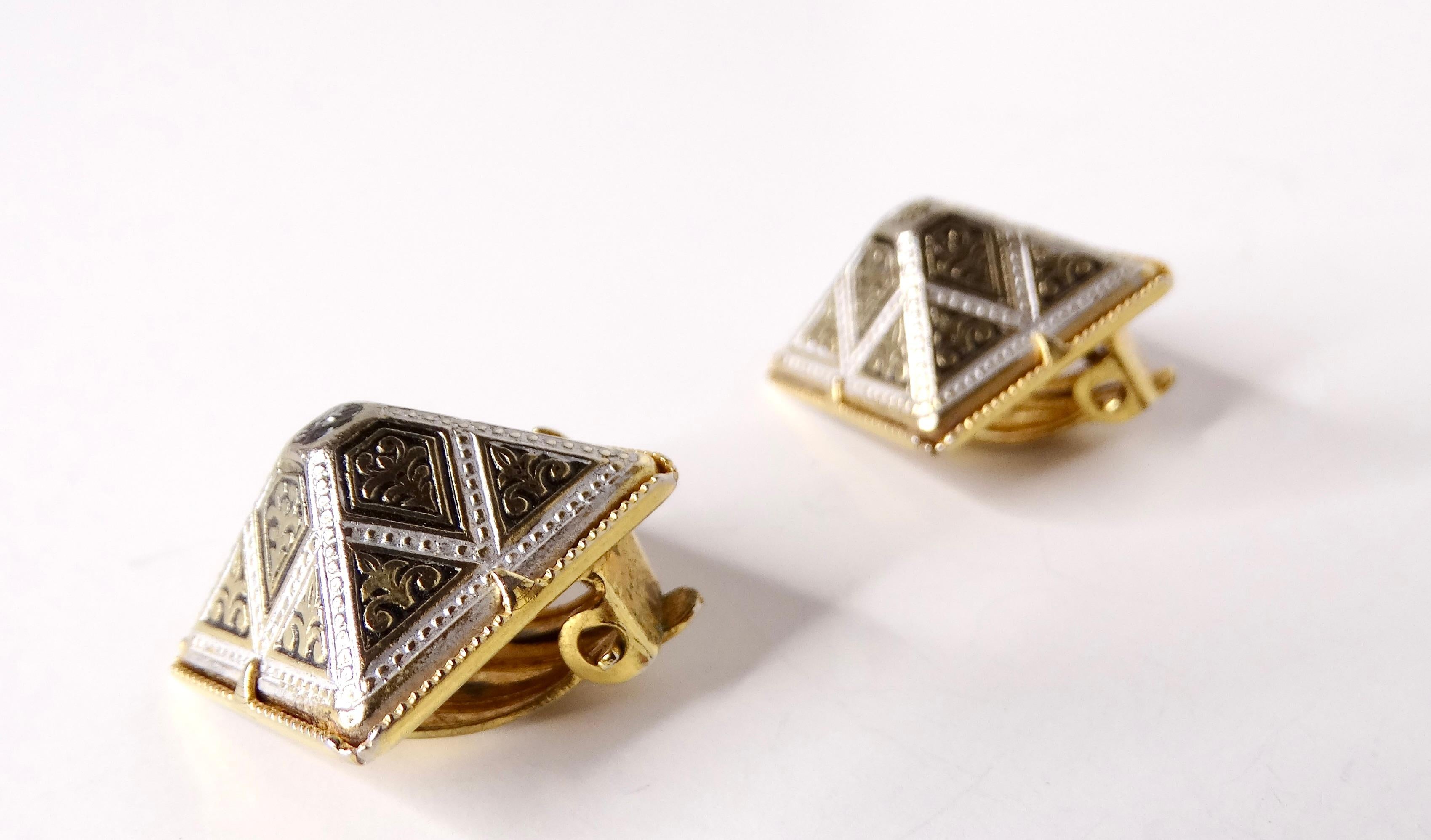 Elevate your accessory game with these exquisite Vintage Spanish Damascene Black & 14k Gold Plated Pyramid Earrings. Their captivating design features intricate damascene patterns that exude timeless elegance, beautifully contrasted by the bold