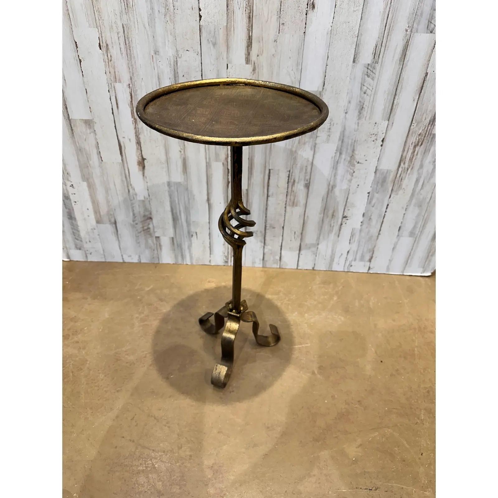 This is wonderful little Spanish made wrought iron drink table with an antiqued gold finish.Contemporary yet antique inspired style for any decor aesthetic. We have Several of these listed all have there own unique design, giving them such wonderful