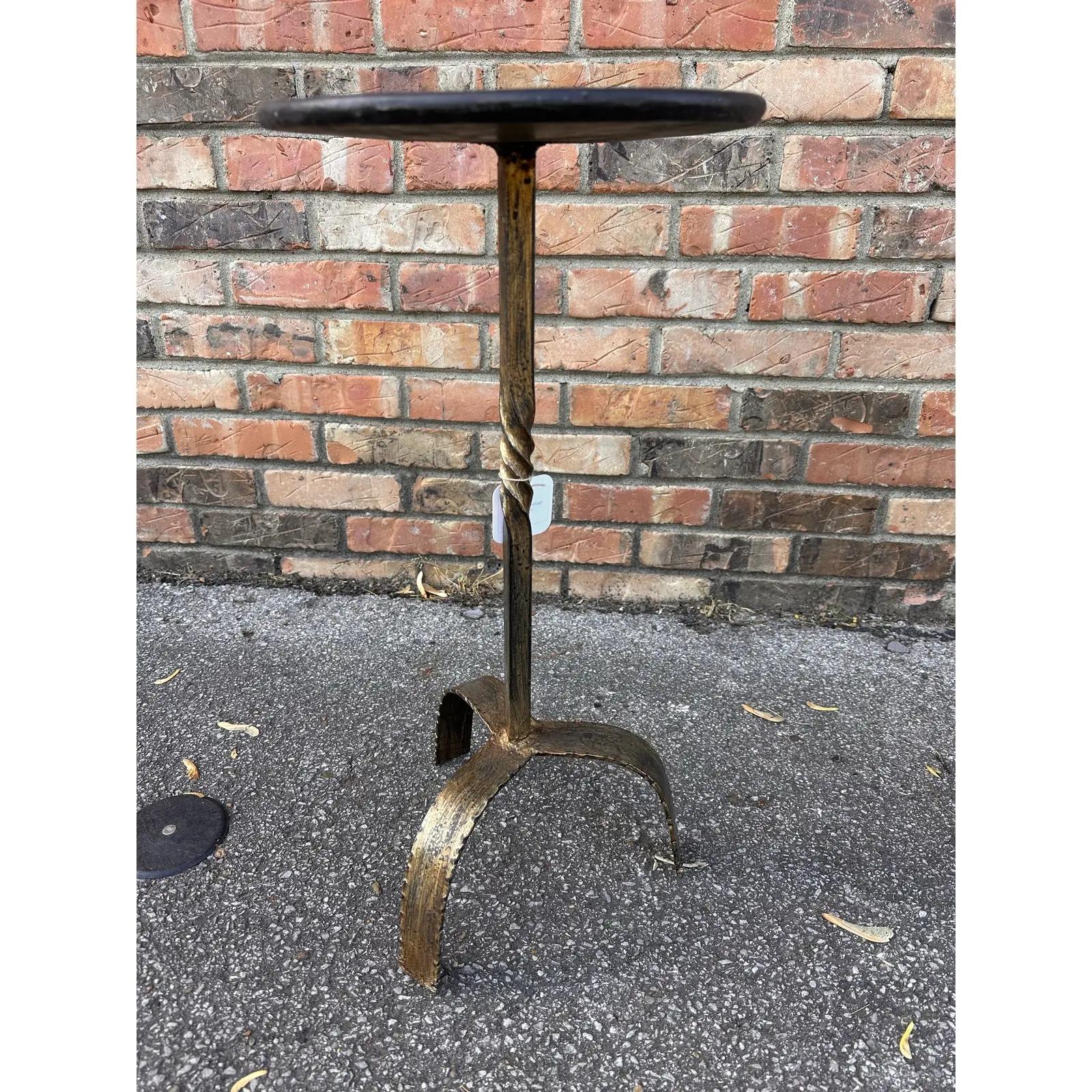 This is wonderful little Spanish made wrought iron drink table with an antiqued gold finish.Contemporary yet antique inspired style for any decor aesthetic. We have Several of these listed all have their own unique design, giving them such wonderful