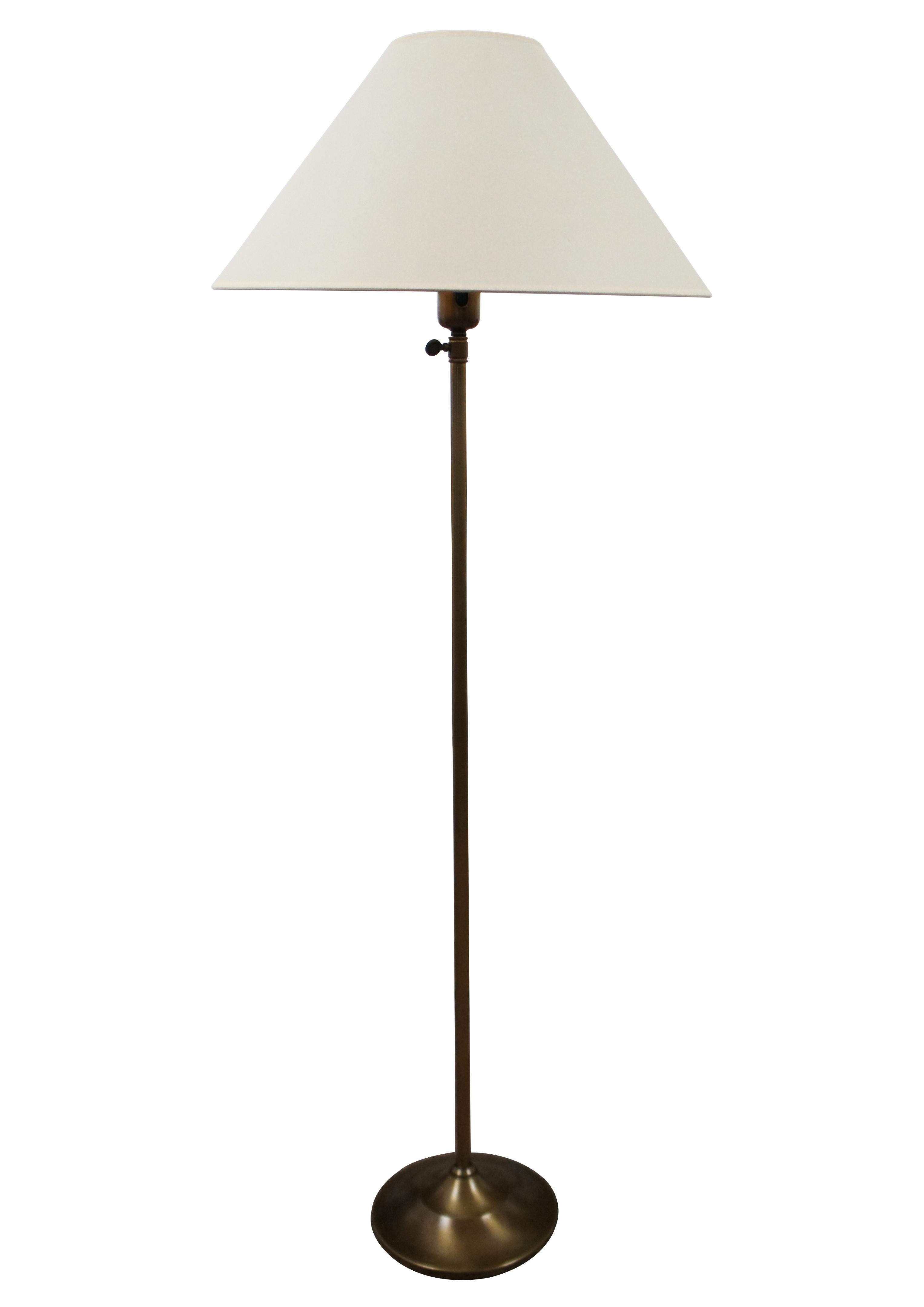 Vintage G & D Spain brass adjustable floor lamp with white shade.

8.5” x 42.5” / Shade - 19” x 9” / Total Height Adjustable from - 49.5” to 60” (Diameter x Height)