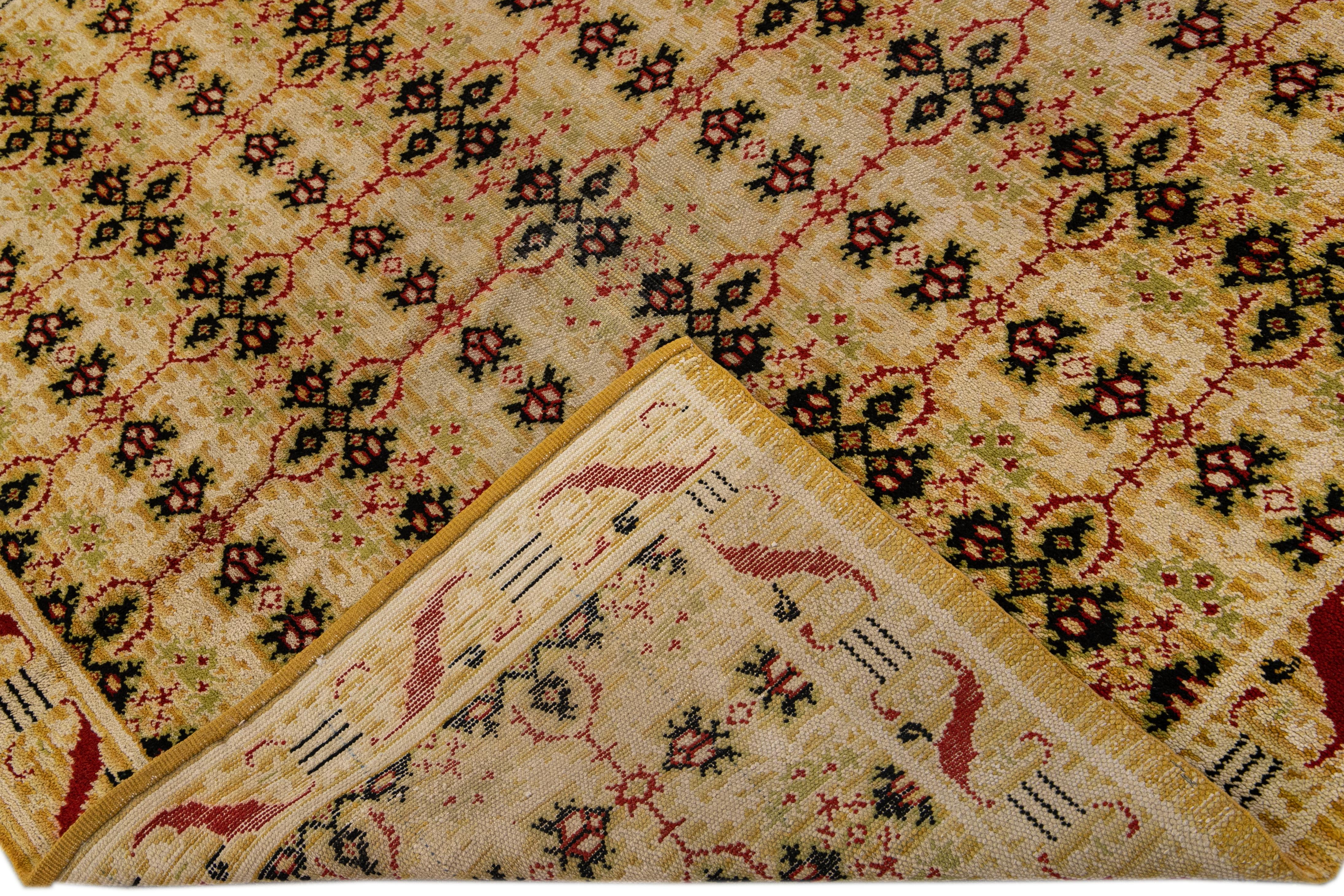 Beautiful vintage Spanish hand-knotted wool rug with the beige and goldenrod field. This Spanish rug has green and red accents in an all-over geometric pattern design. 

This rug measures 6'5