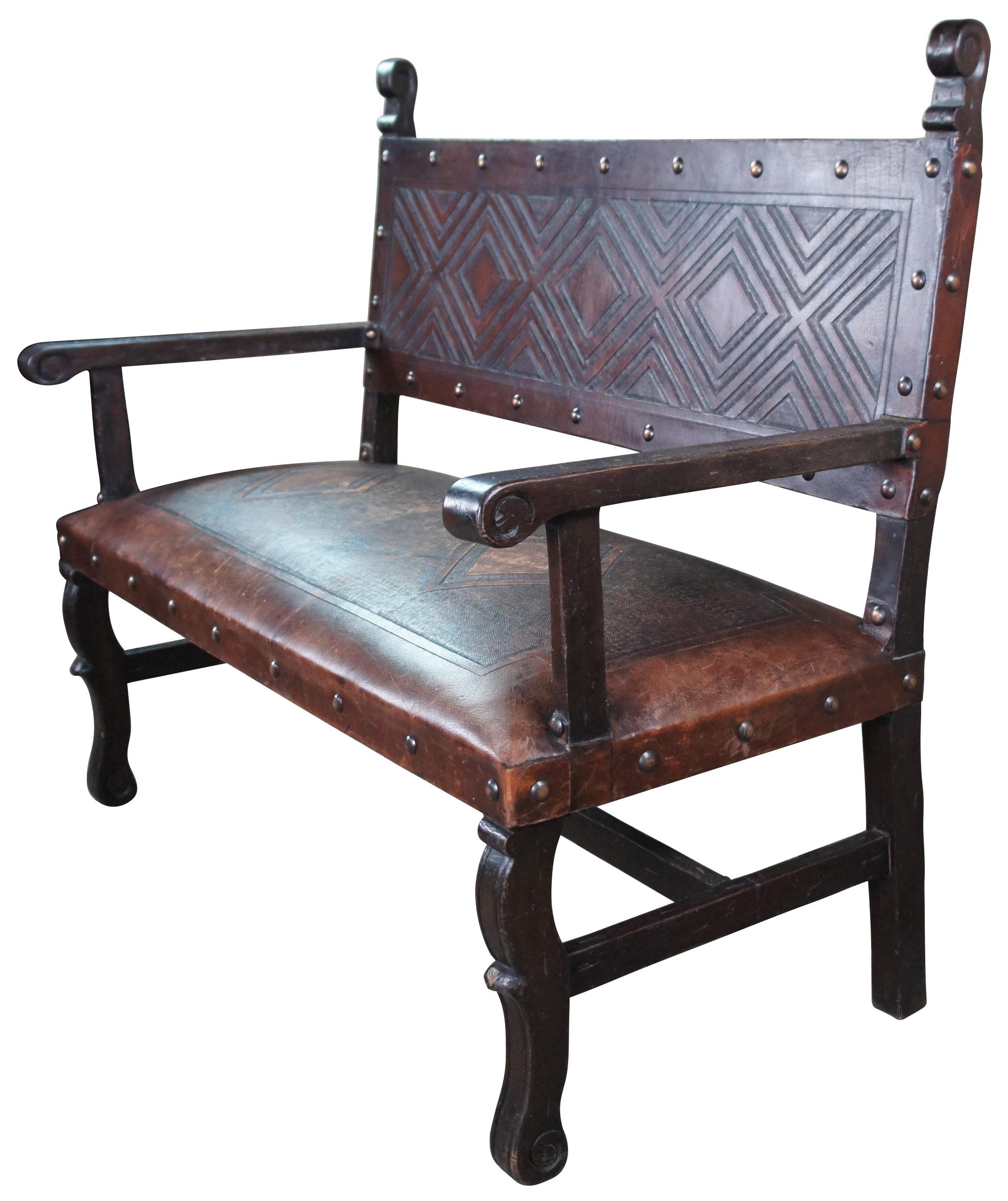 Vintage Spanish Heritage tooled leather bench featuring geometric diamond and nailhead design. Measures: 51