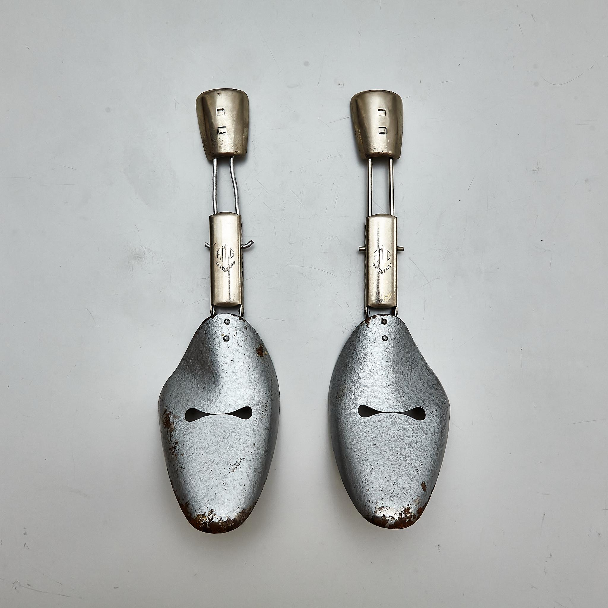 Unearth a piece of shoemaking history with this pair of vintage metal shoe trees, meticulously crafted in Spain circa 1960 and sealed with AMD's patented innovation. These shoe trees have aged gracefully, bearing some traces of rust and minor wear,