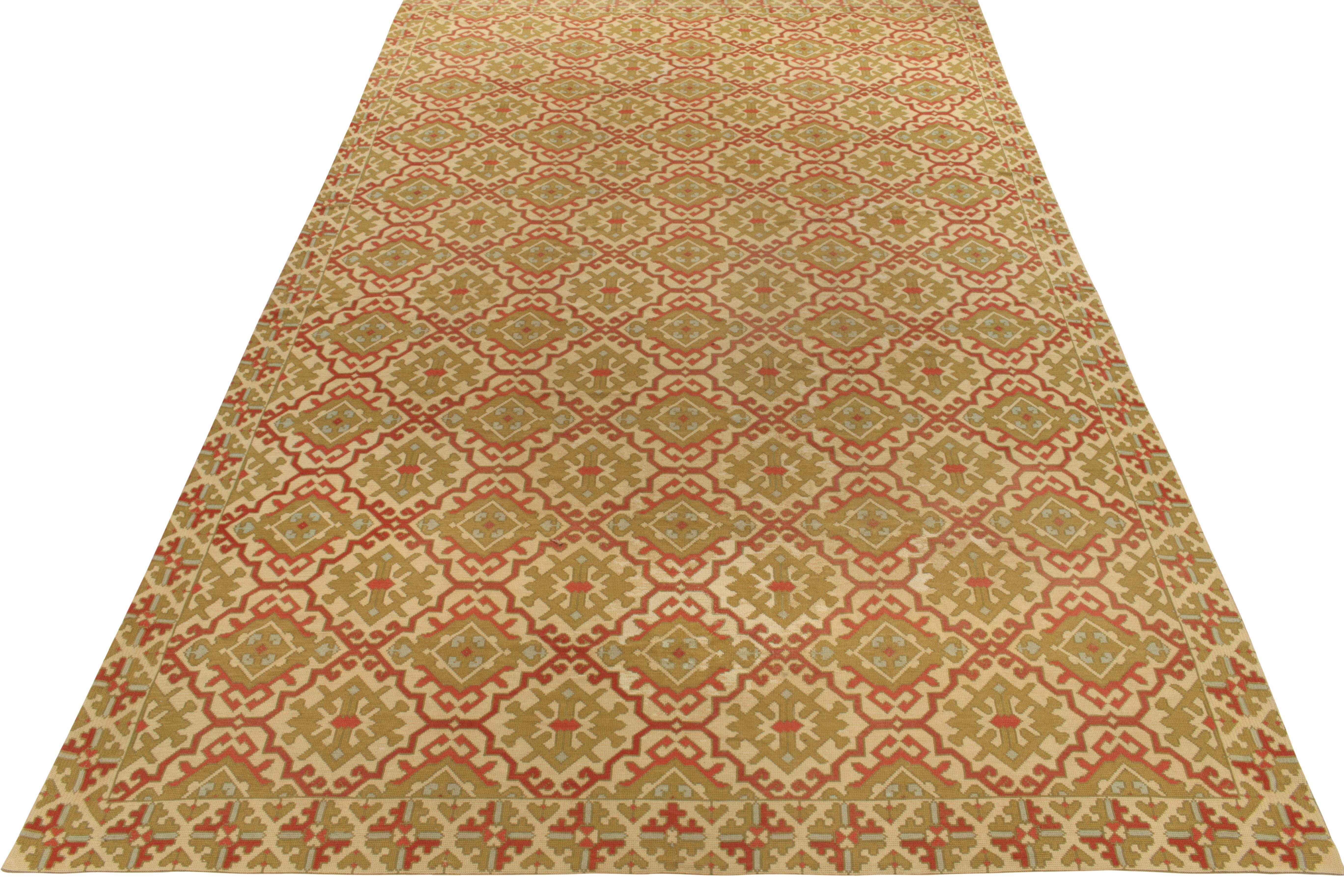 Originating from Spain circa 1950-1960, a vintage mid-century 10x16 needlepoint rug joining Rug & Kilim’s Antique & Vintage collection. Hand crafted in wool, the piece enjoys a meticulous geometric pattern in bright red, beige-brown and pastel green