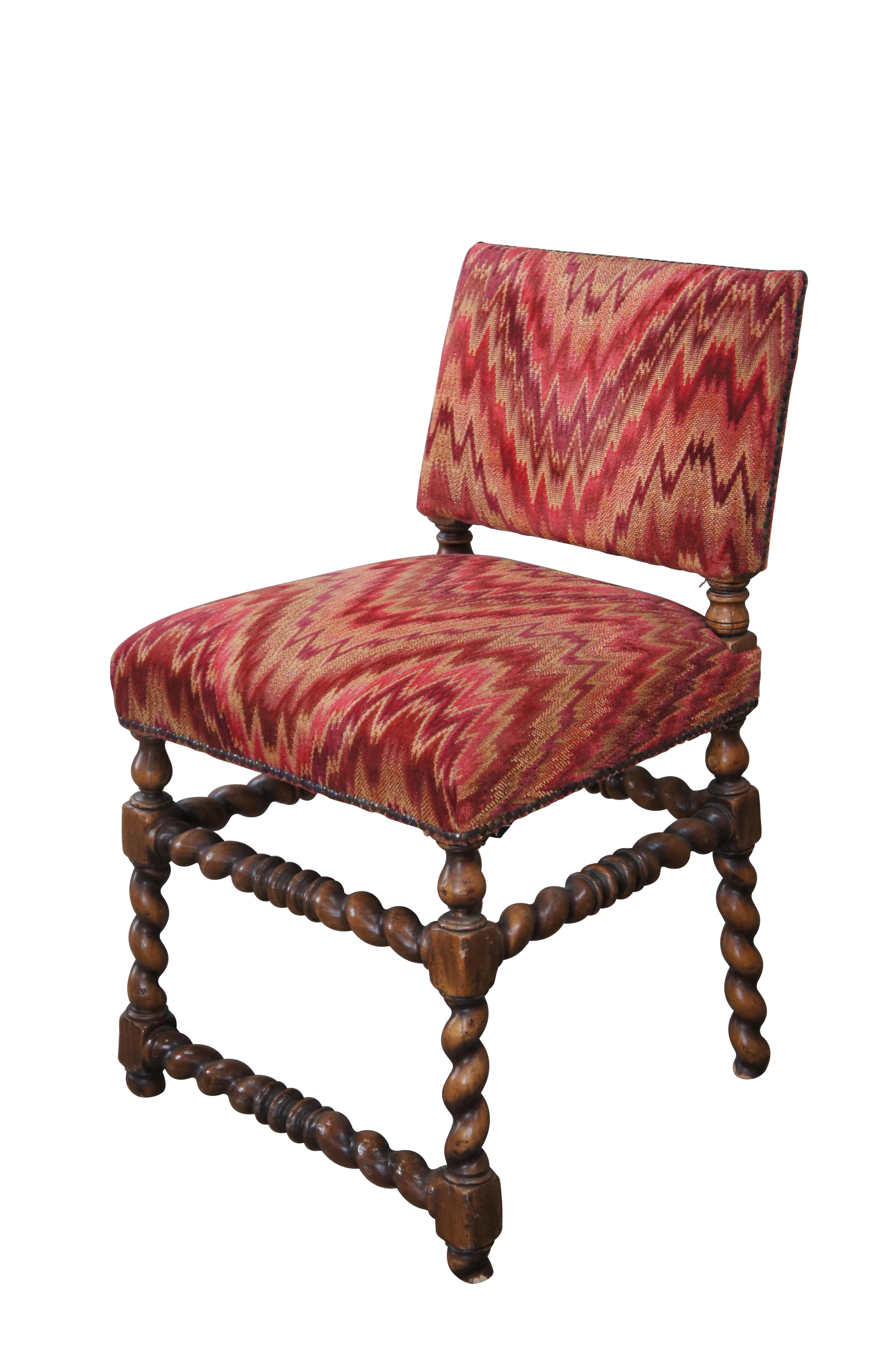 Vintage Spanish oak barley twisted vanity chair featuring a neat red Southwestern upholstery with nailhead trim.

Dimensions:
21