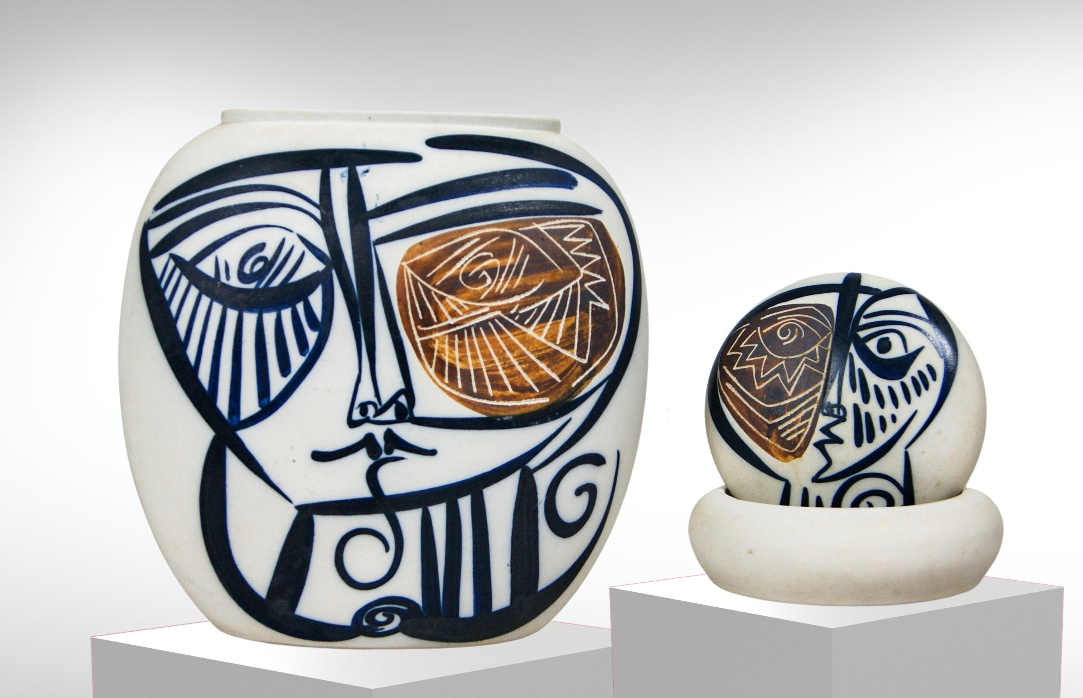 Vintage Spanish studio pottery vase and matching lidded bowl. 
Decorated with hand-painted brutalist Picasso-esque cubist faces. 
Both the vase and the lidded bowl show variations to their faces. 
Very decorative piece. 
Artist signed at the