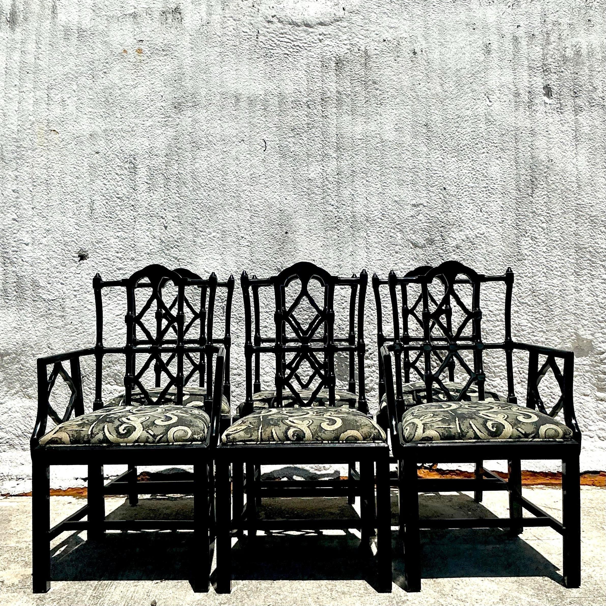 Elevate your dining experience with this set of 6 Vintage Regency Lacquered Chippendale Dining Chairs. These American-style chairs feature elegant lacquered finishes and classic Chippendale design, adding a sophisticated touch to any dining room.