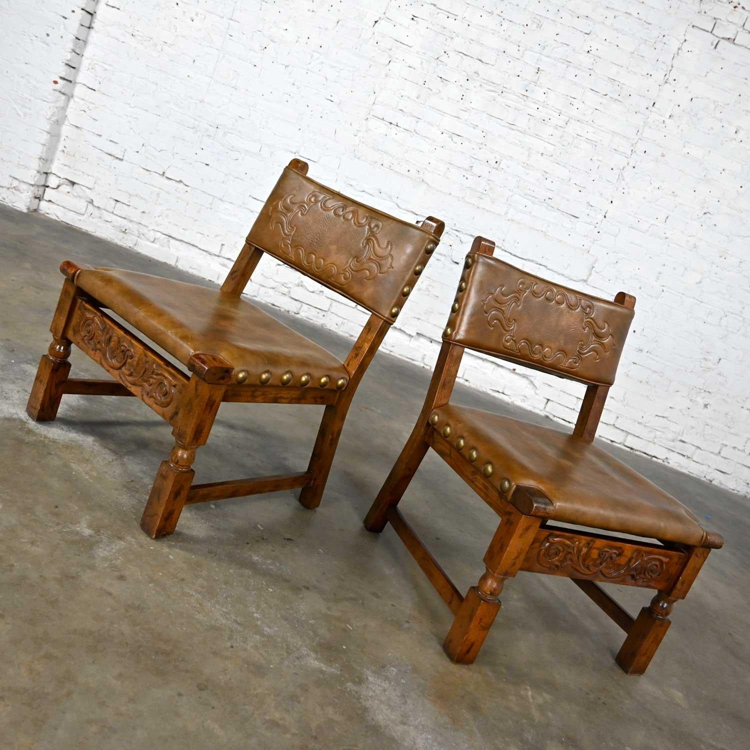 Spanish Colonial Vintage Spanish Revival Oak Pair of Chairs with Tooled Cognac Faux Leather Seat For Sale