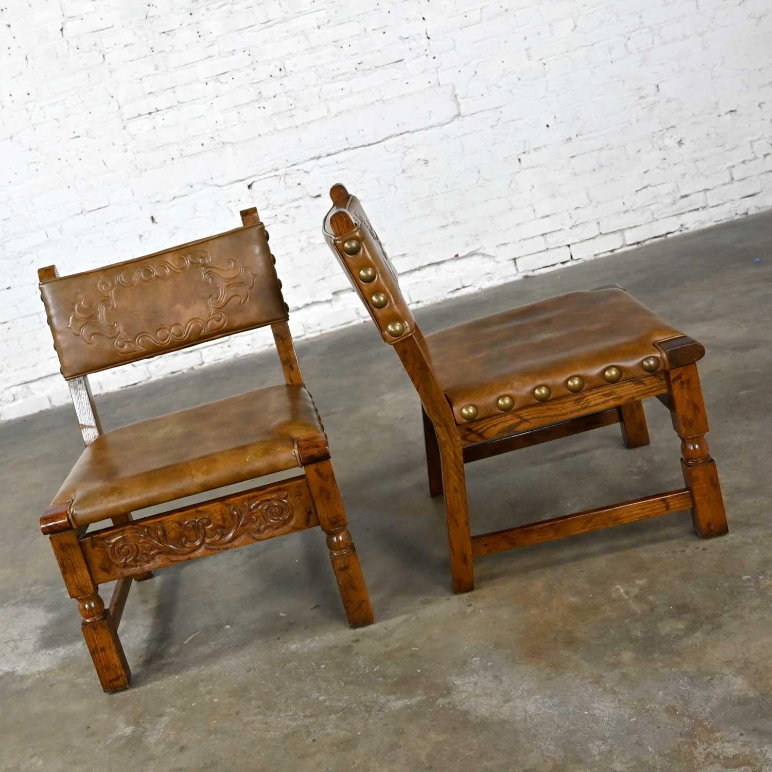 Unknown Vintage Spanish Revival Oak Pair of Chairs with Tooled Cognac Faux Leather Seat For Sale