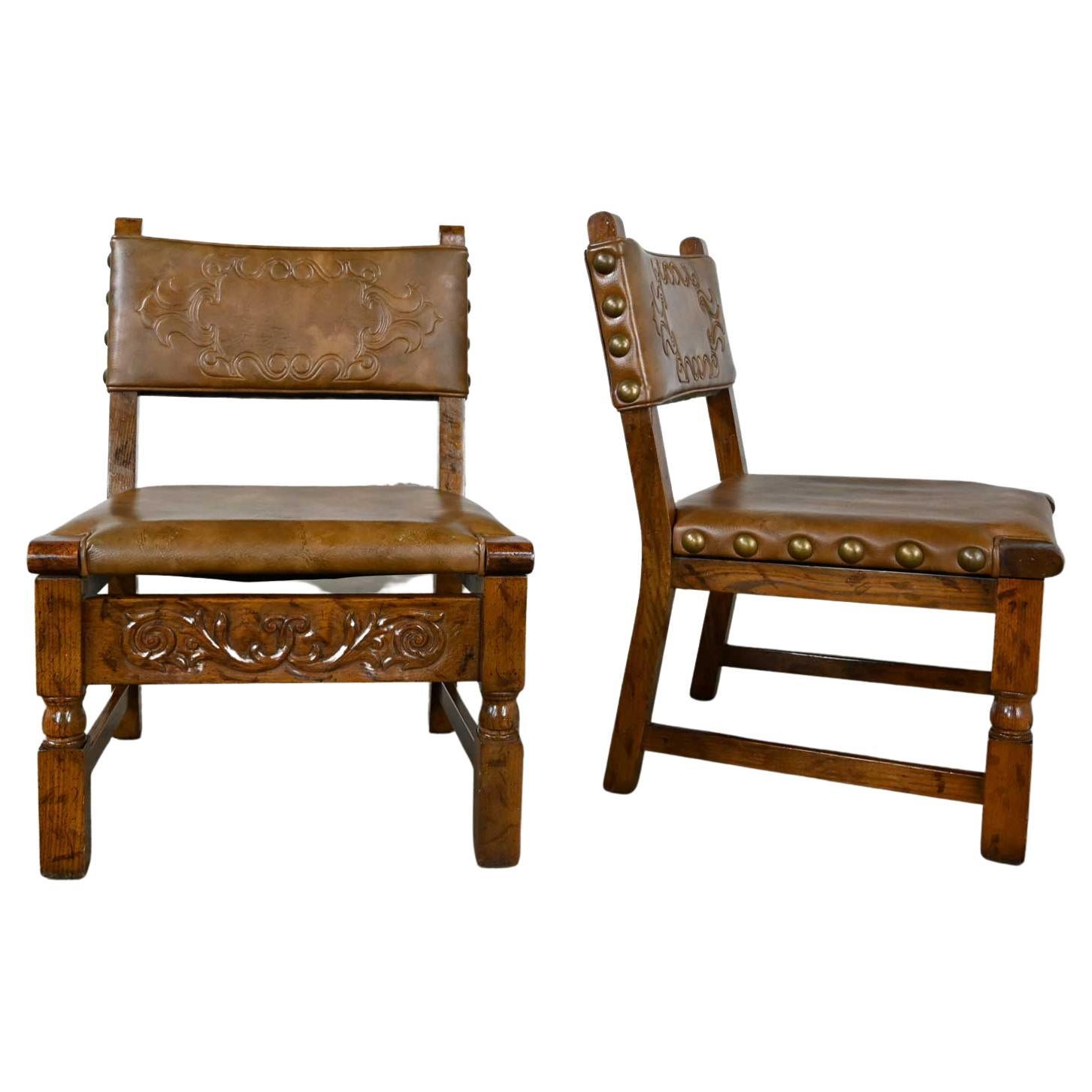 Vintage Spanish Revival Oak Pair of Chairs with Tooled Cognac Faux Leather Seat