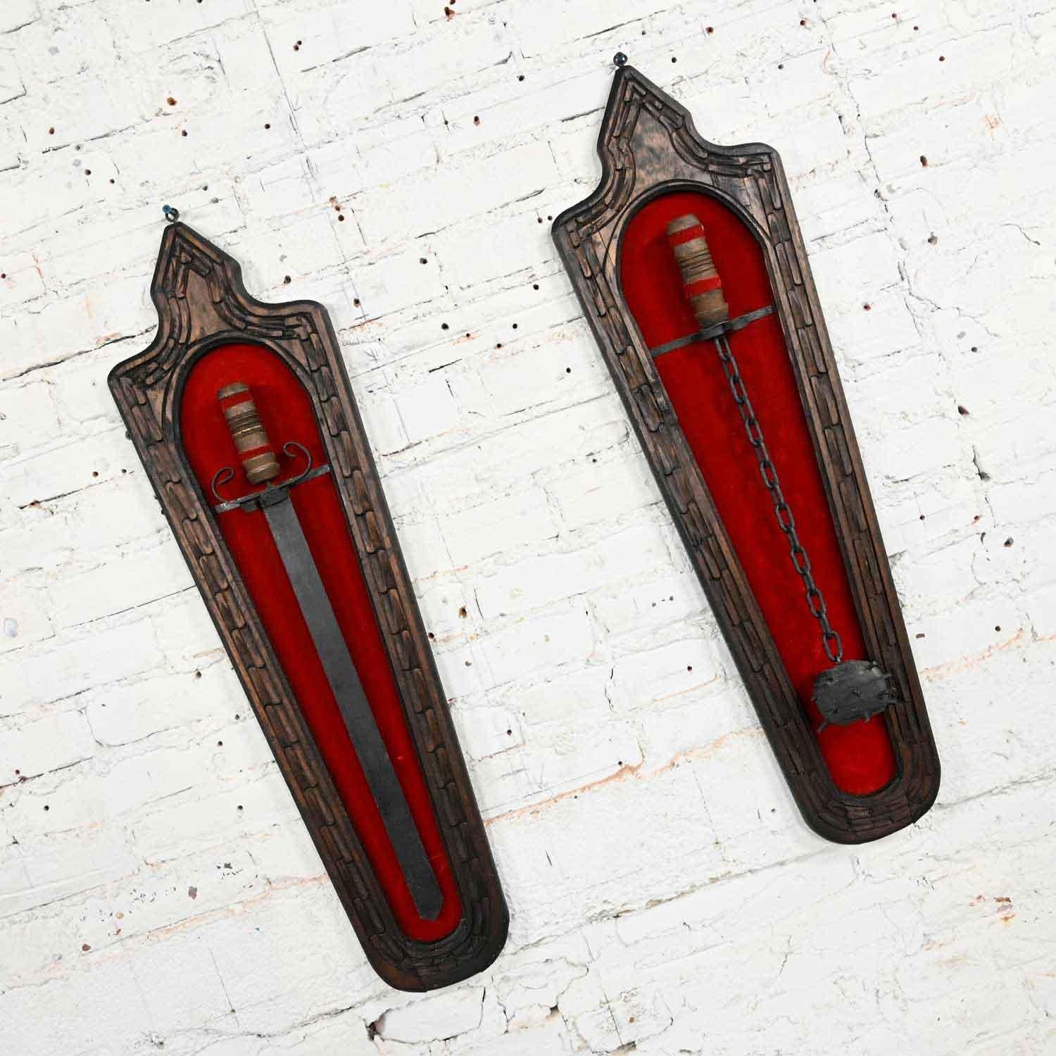 Awesome vintage Spanish Revival tavern sword and medieval ball flail wall décor comprised of carved wood frames with red felt backing, wood handles, black painted metal & wood sword & flail in the style of Witco. Beautiful condition, keeping in mind