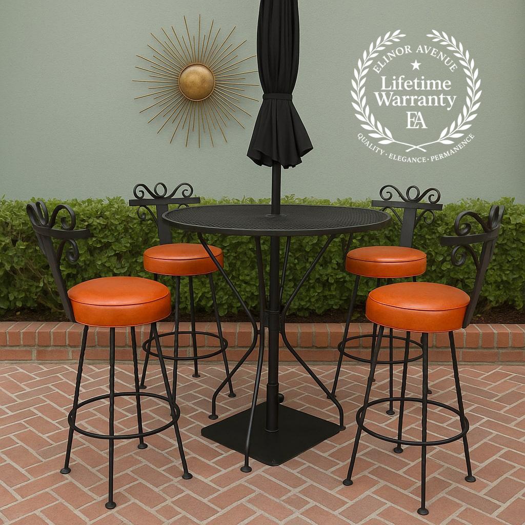 An exceptional complete vintage bar set featuring four wrought iron swivel bar stools, a matching round mesh-top bar table, and a heavy wrought iron umbrella stand. Crafted in the Spanish Revival / Hollywood Regency style, these pieces showcase bold