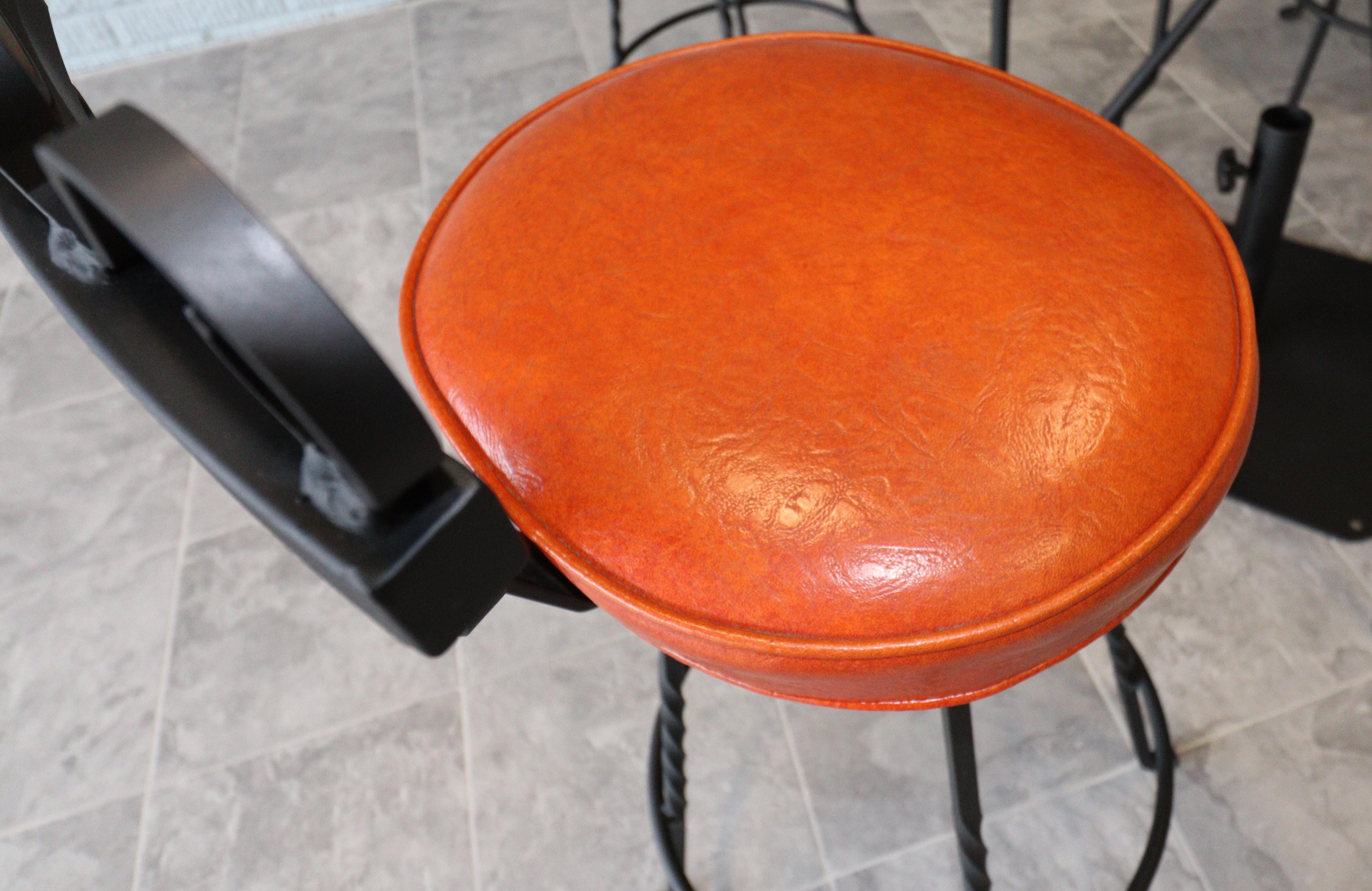 Vintage Spanish Revival Wrought Iron Swivel Bar Stool Set-Burnt Orange Vinyl In Good Condition For Sale In Omaha, NE