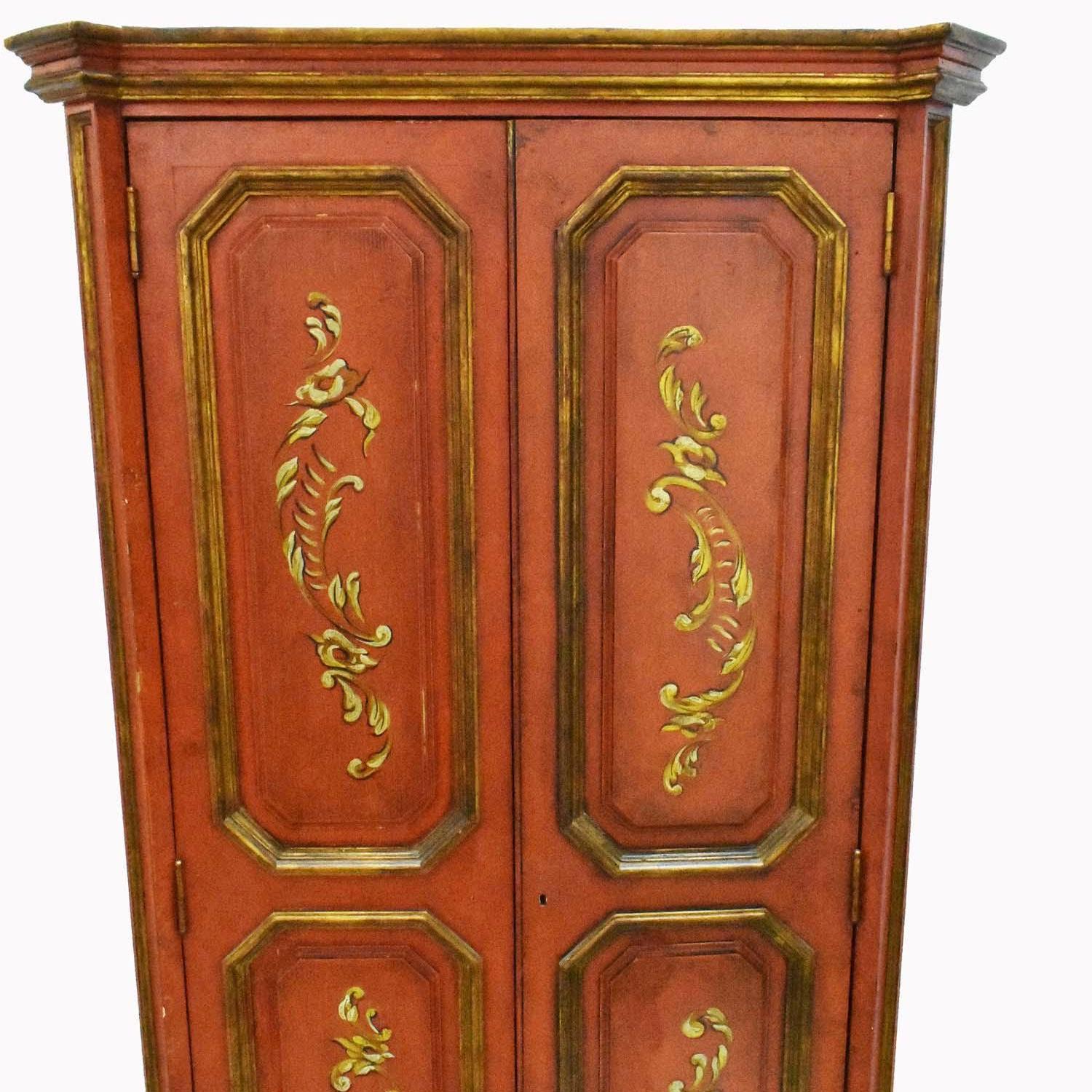 This is a very nice Armoire or Cupboard made First Half 20th Century in Spain. Rectangular, with a pair of paneled doors opening to a fitted interior, with a shelf and gilt spindles, the corners with canted stiles, decorated with gilt foliage. A