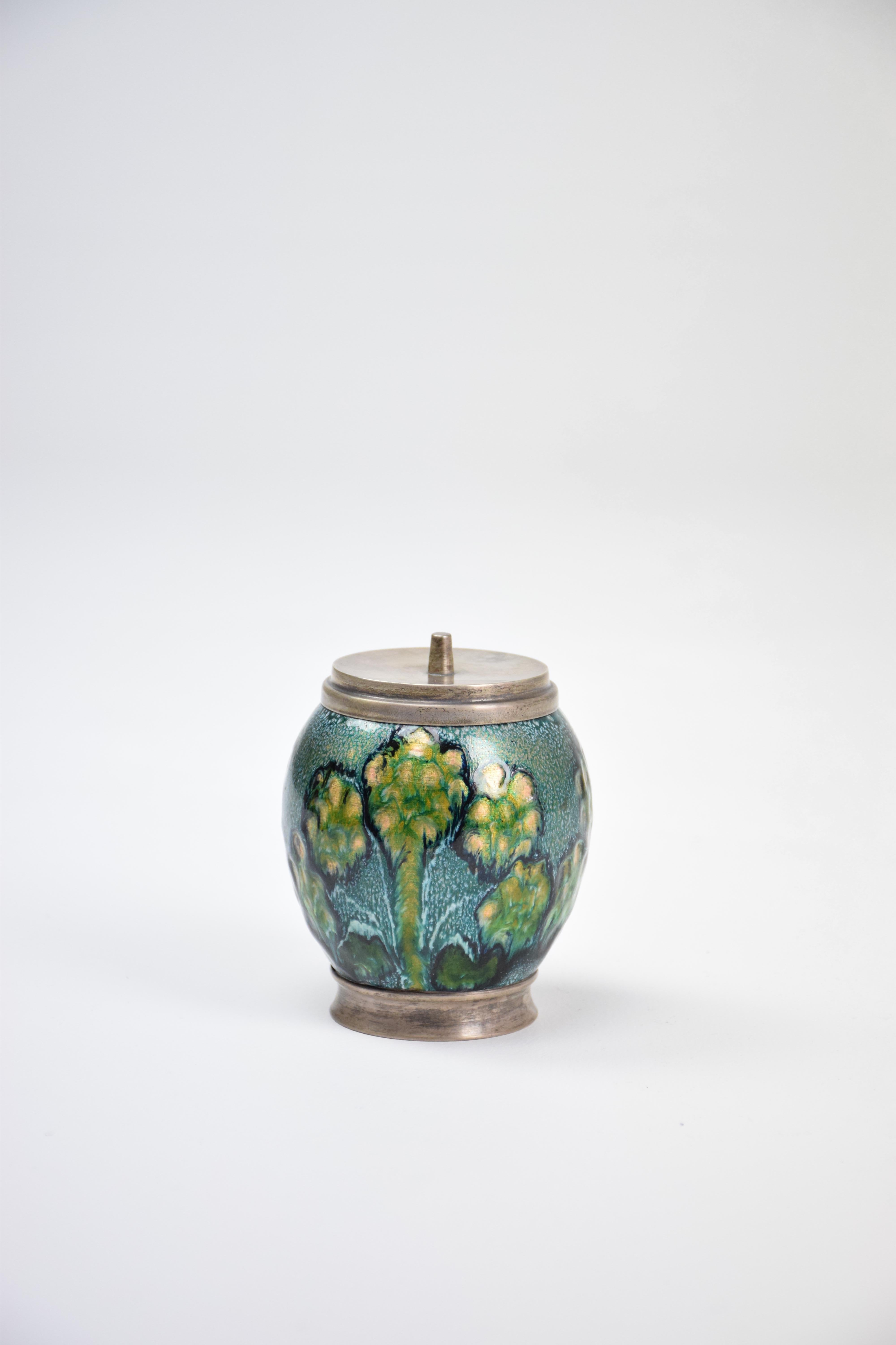 20th-century vintage lidded pot or box handcrafted with hand-painted detailed flowers in hues of blue, green and yellow. 
Spain, circa 1970s.
 