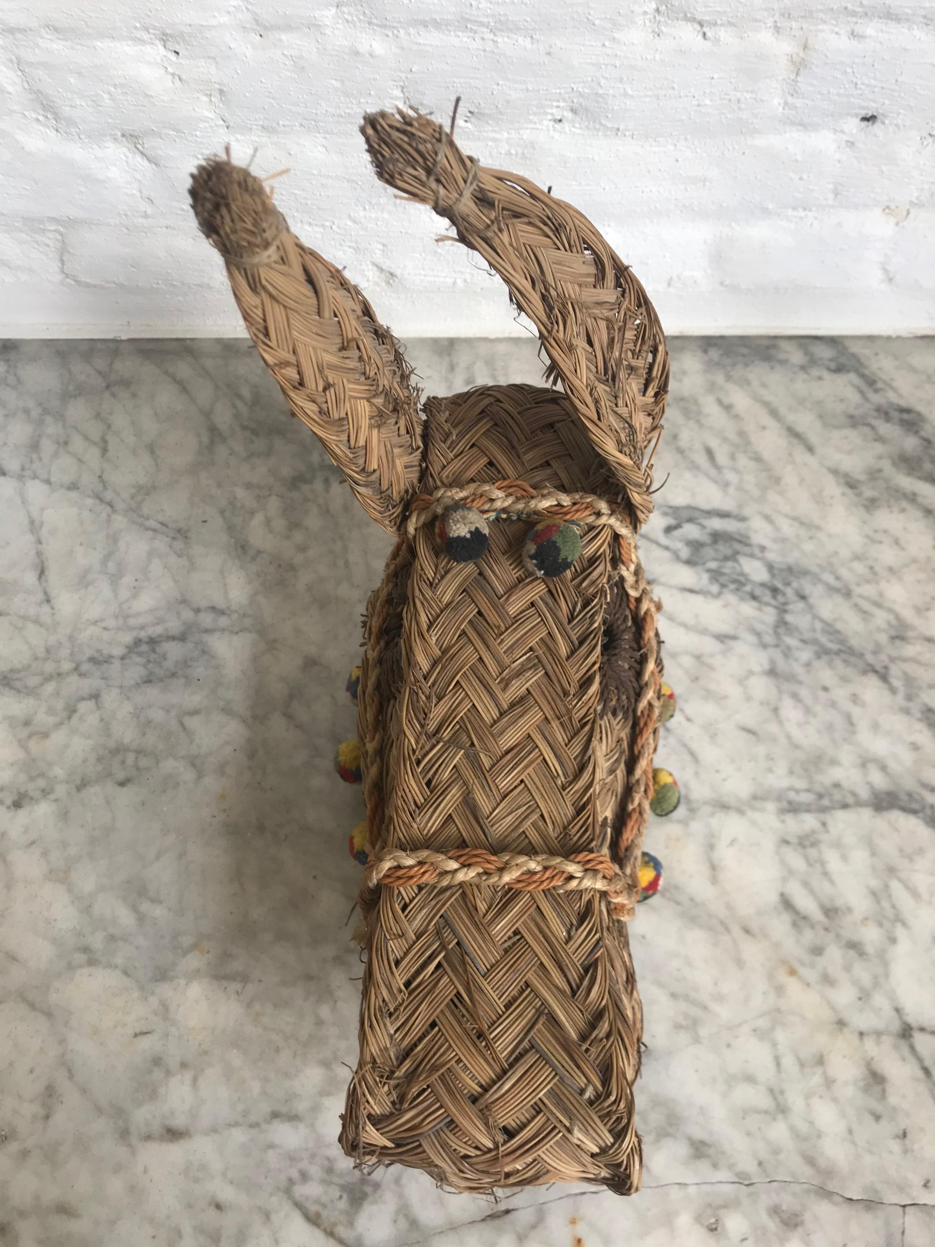 Spanish folk art hand woven esparto straw mule head with textile fringe, circa 1970. In really good condition ready to hang.
Esparto is a type of fibrous grass used in the making of baskets and espadrilles in Northern Spain.