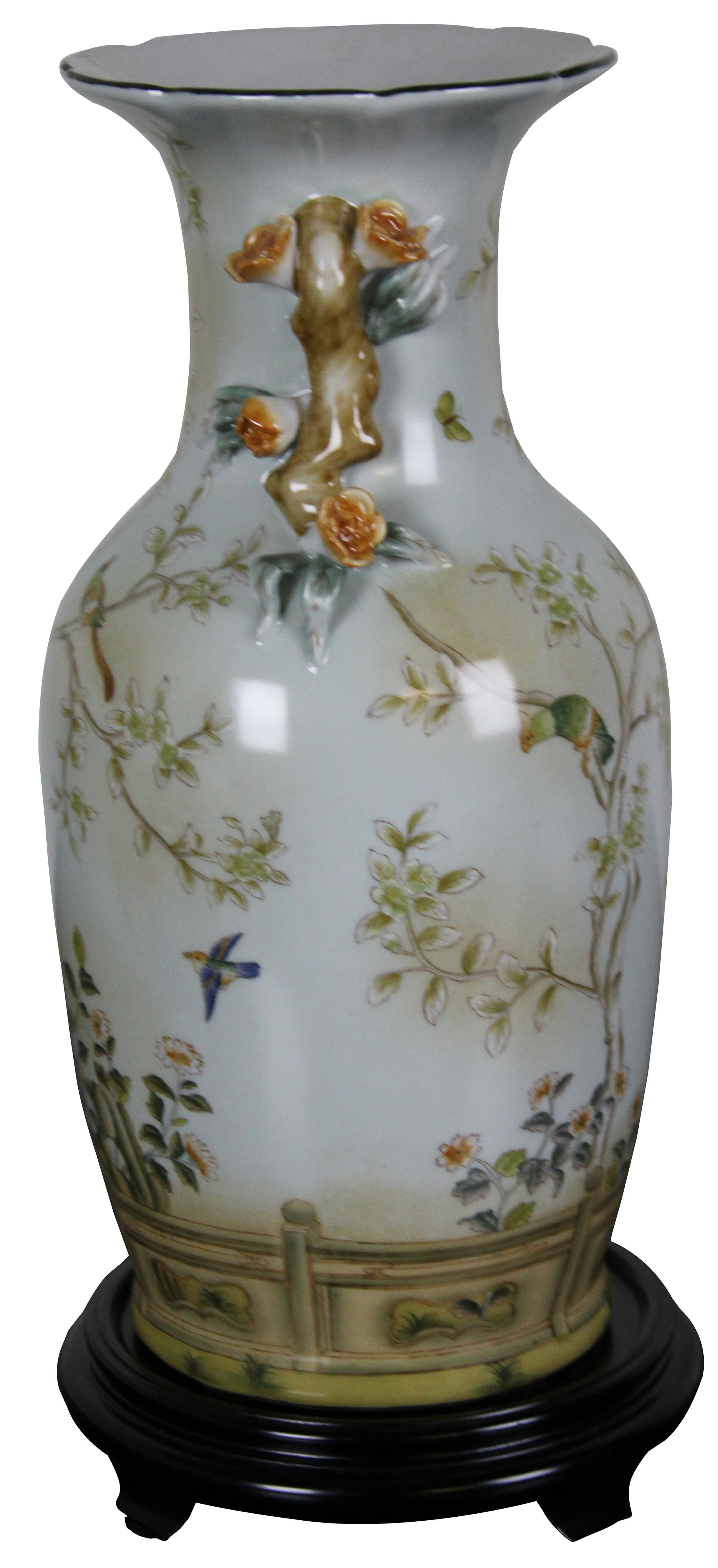 Vintage hand painted baluster form vase by Speer Collectibles. Features a floral motif with birds, butterflies, high relief and footed wood pedestal base.

Measures: Vase: 16