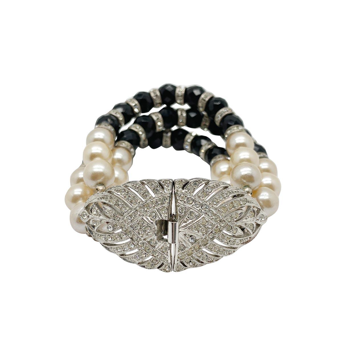 A seriously stylish vintage Sphinx Art Deco bracelet. Featuring a sublime clasp and a triple strand bracelet with faceted glass beads, crystal rhondelles and lustrous glass pearls.

Vintage Condition: Very good without damage or noteworthy