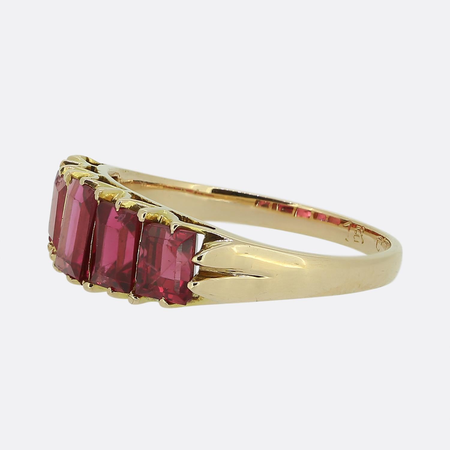 Here we have an 18ct yellow gold ring featuring five baguette-cut red spinel stones. The stones are wonderfully matched whilst being individually set in a single row formation across the face whilst graduating in size towards the centre. The band is