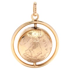 Breloque globe tournant vintage en or jaune 18 carats, Grand monde