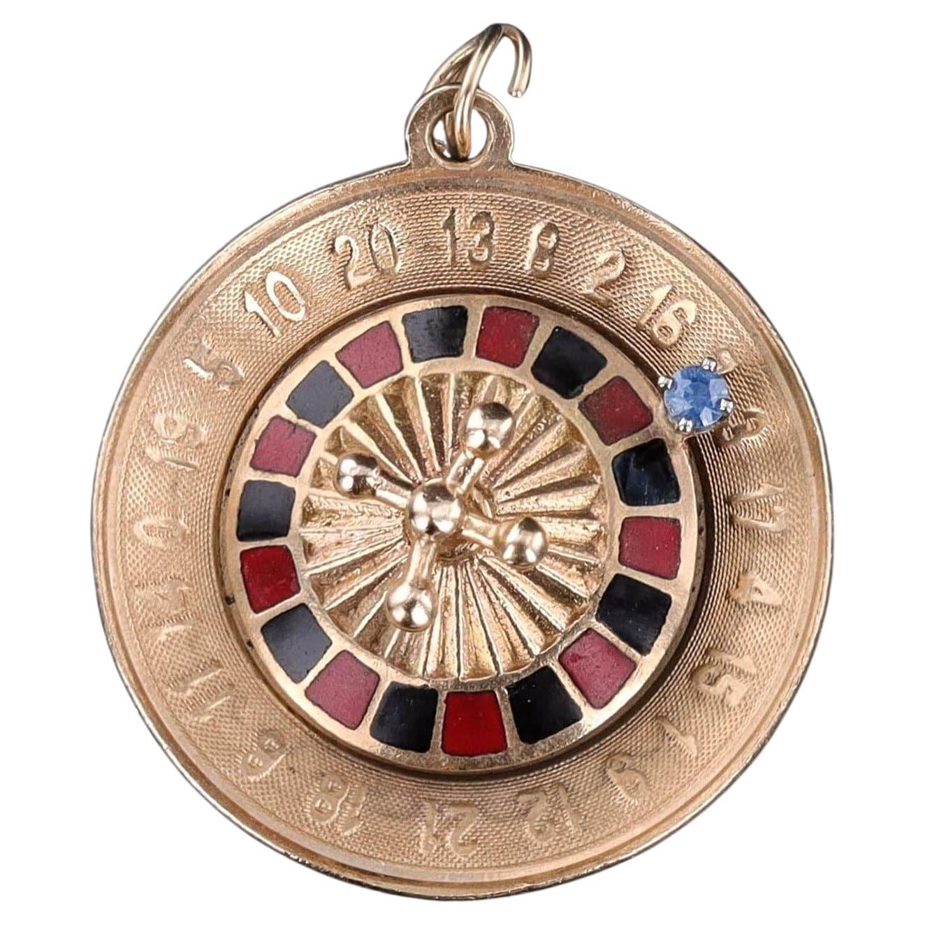 Pendentif en or 14k avec roulette vintage en vente