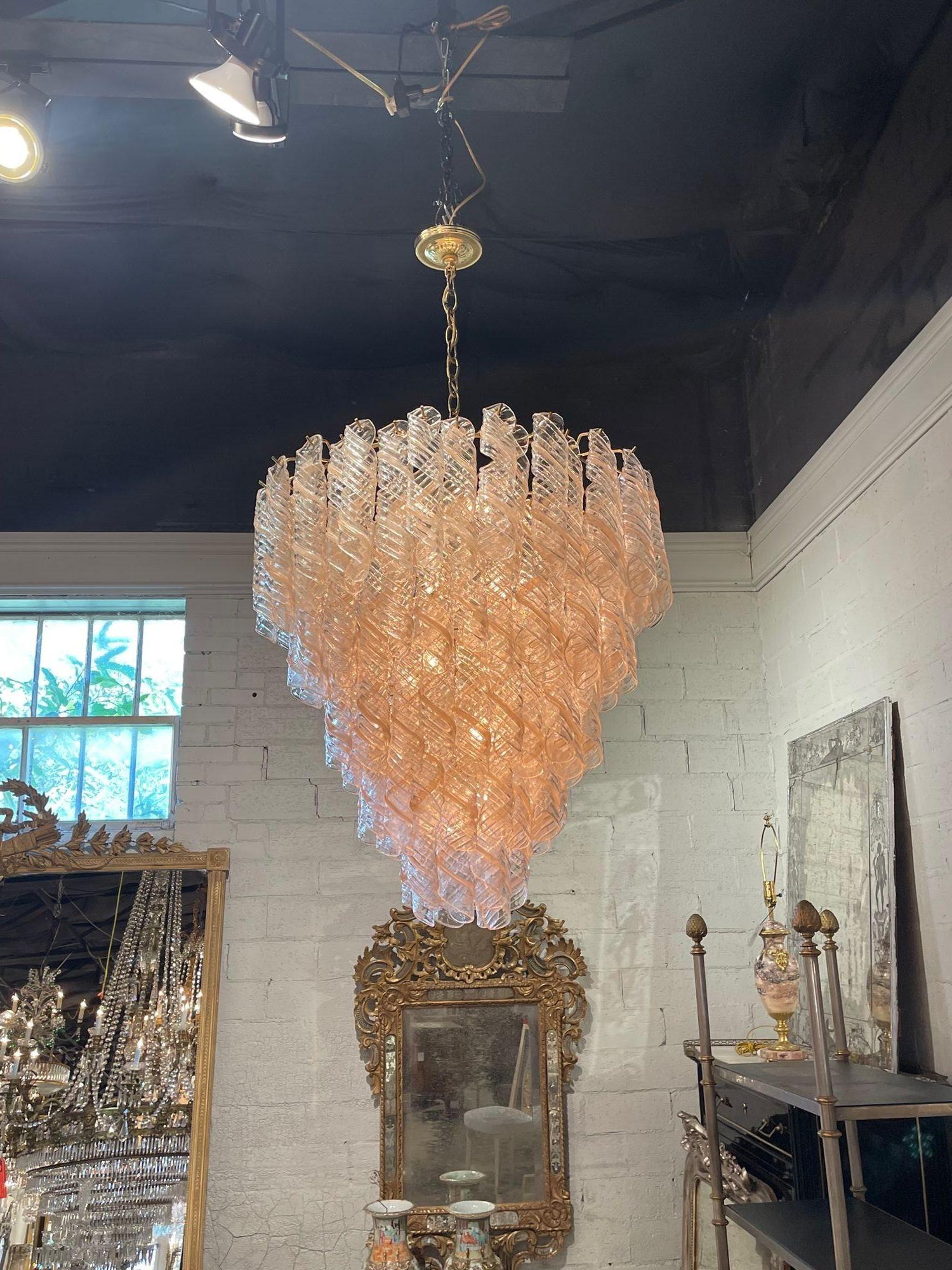 Gorgeous vintage spiral blush colored Murano glass chandelier. Beautiful subtle color along with a beautiful scale and shape. Creates a very stylish presence! Amazing!!