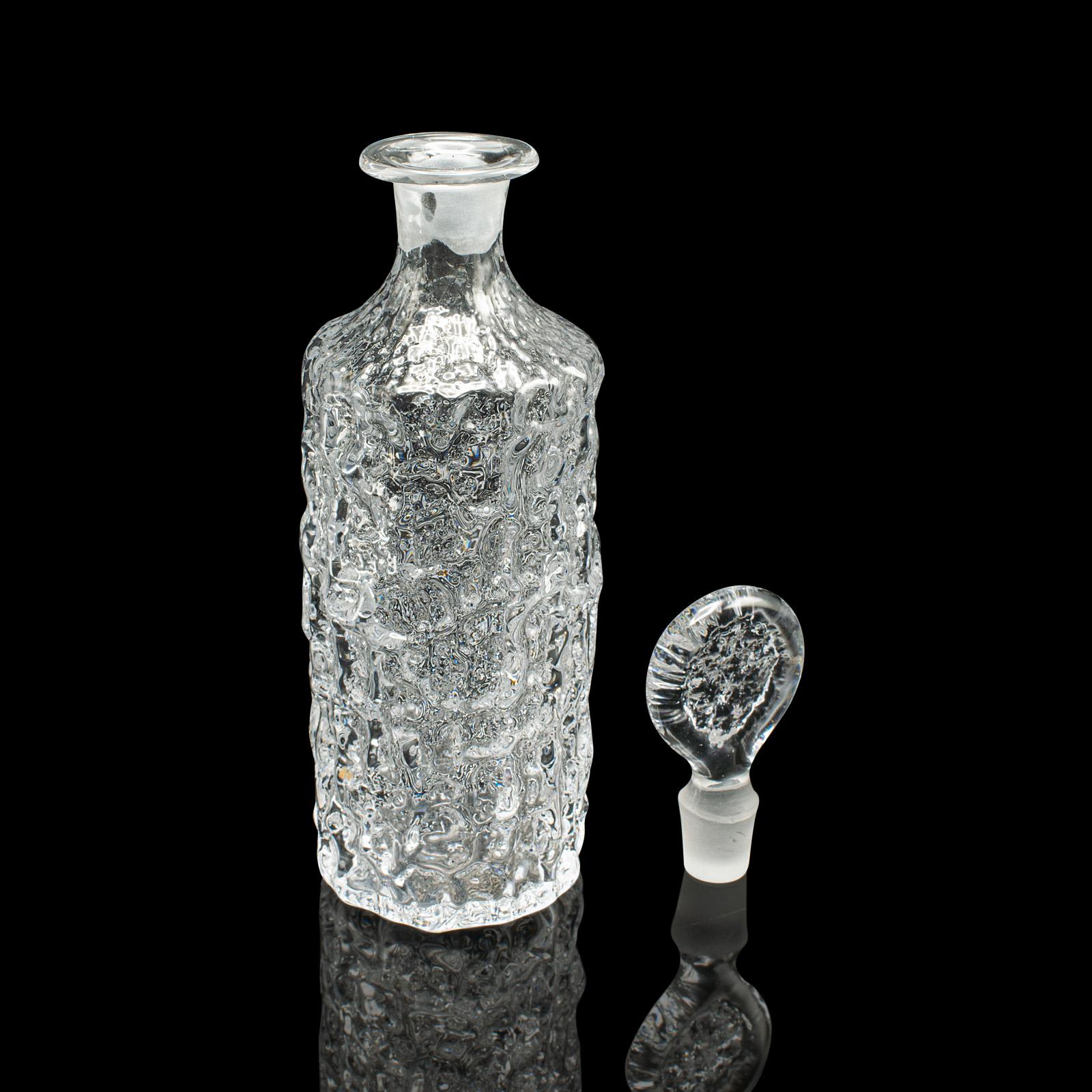 
This is a vintage spirit decanter. An Italian, art glass glacier finish liqueur or aperitif vessel, dating to the late 20th century, circa 1970.

Bright and distinctive finish to this charming Italian example
Displays a desirable aged patina and in