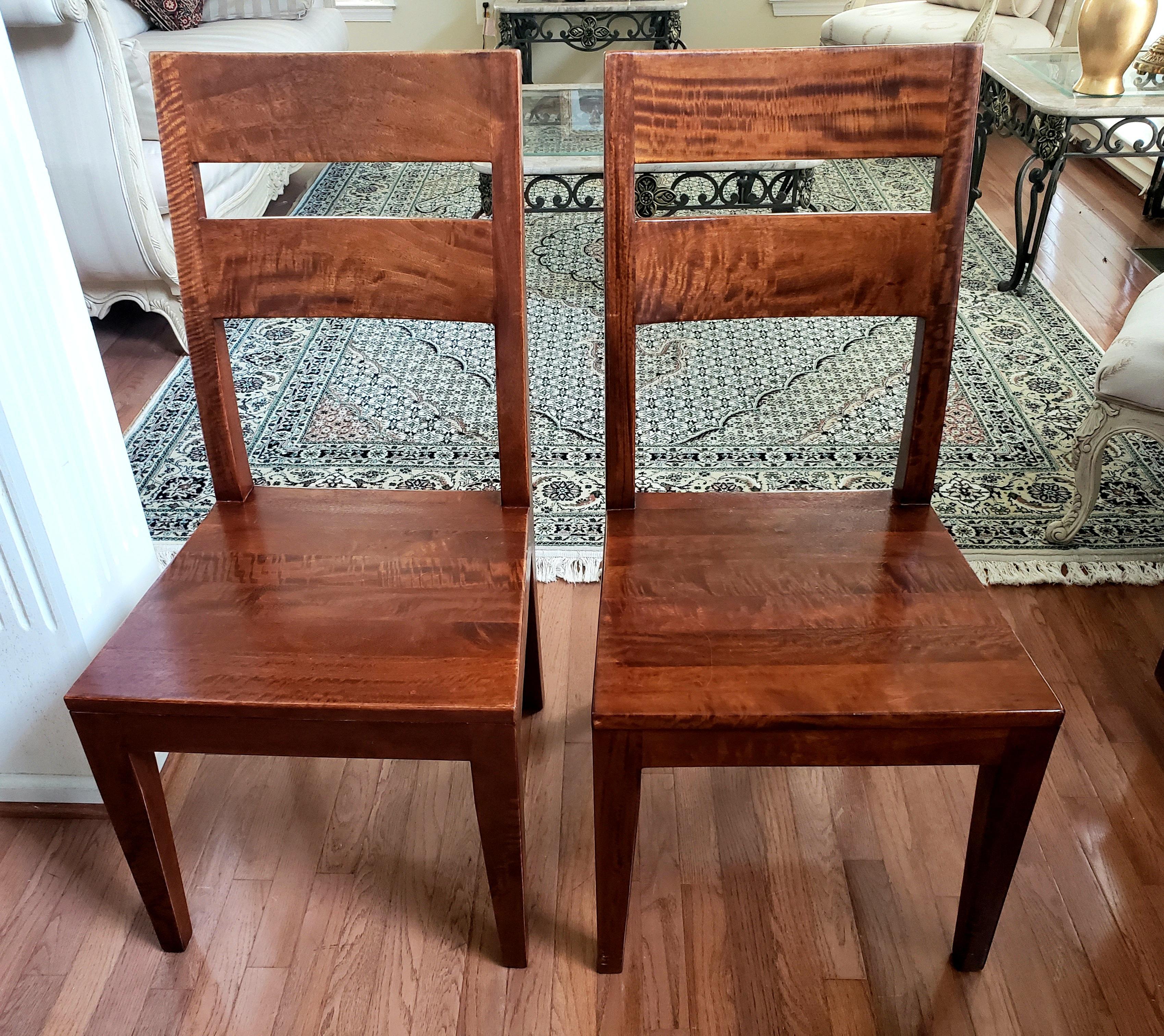 Vintage pair of splendid Bubinga Wood in excellent condition. These chairs are all solid Bubinga throughout. Bubinga is also called African Rosewood. Admire the beauty of plain Bubinga wood in a simple but elegant design. Chairs measure 19.5