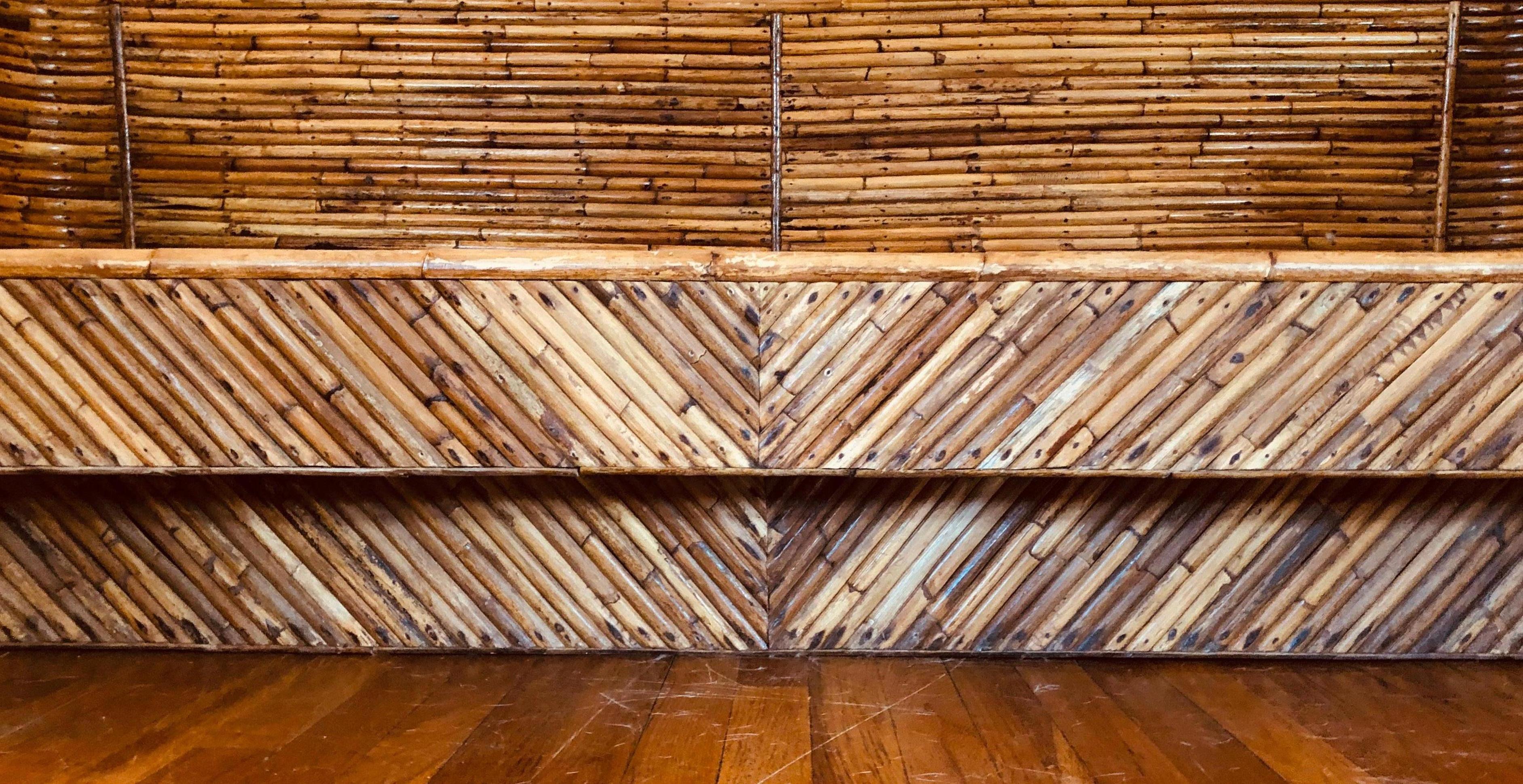 Such a well-constructed solid piece of furniture that shall be here long after we are. Pieces of split-reed bamboo have been artfully mitred & affixed to a club-style sofa. Handmade in the 1970s by native Filipinos and then shipped to the US.
