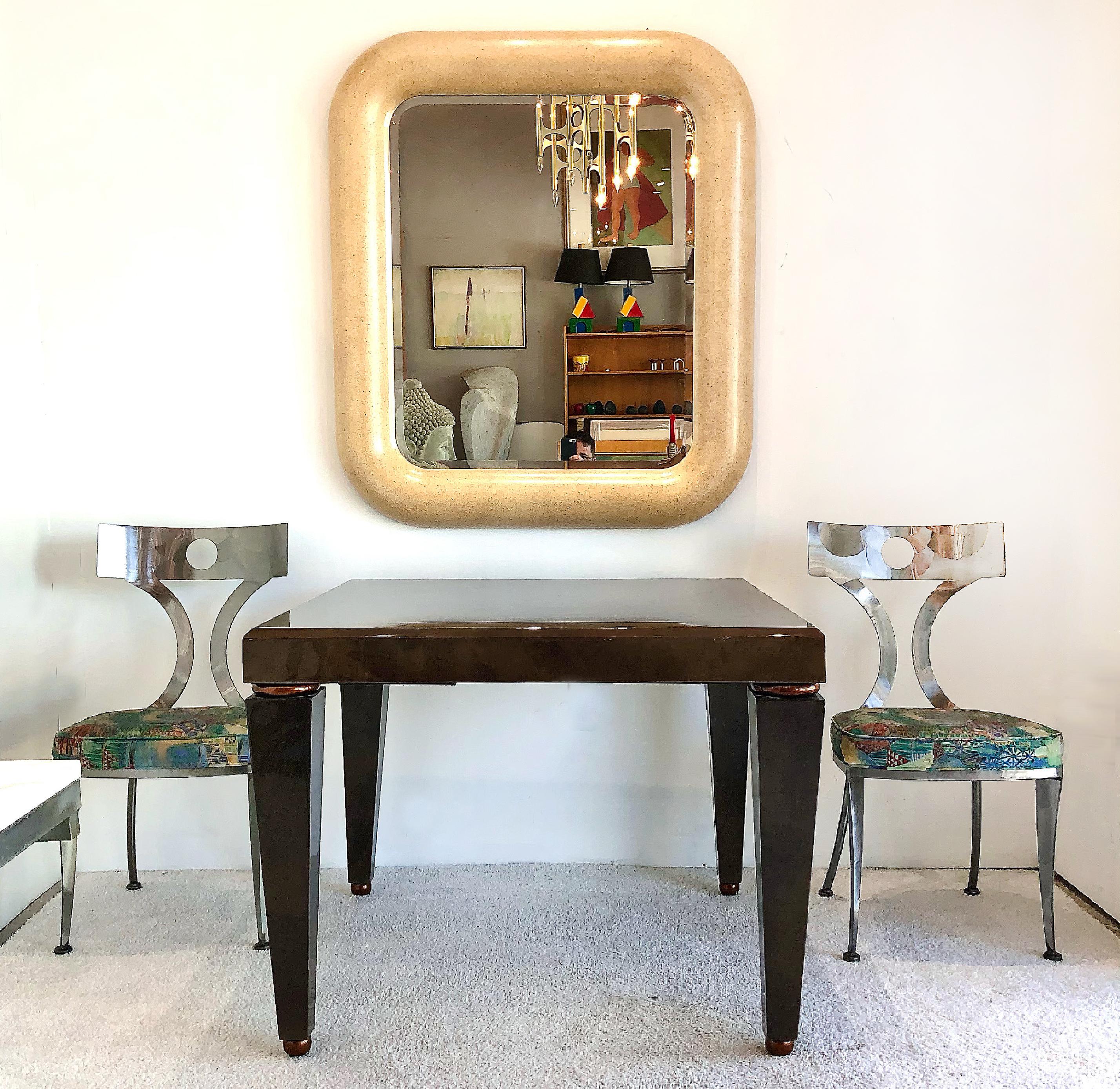 Enrique Garcel Springer style goatskin game table

Offered for sale is a 1980s Karl Springer style chocolate brown lacquered Goatskin Game Table The table is created in the Postmodern style with gilt-copper ring details on the stylized tapered legs