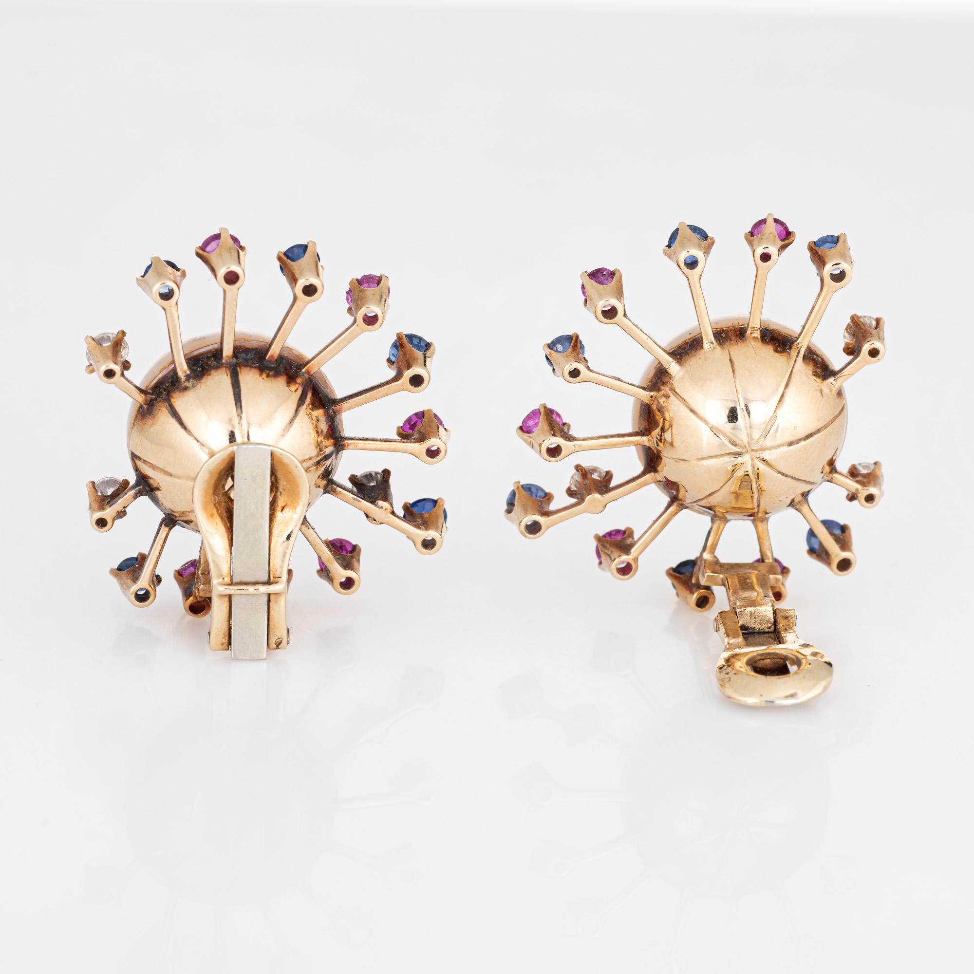 Striking pair of vintage 'Sputnik' earrings set with mabe pearls, diamonds & gemstones (circa 1950s to 1960s) crafted in 14k yellow gold. 

Two Mabe pearls each measure 16mm, accented with an estimated 0.60 carats of diamonds (estimated at H-I color