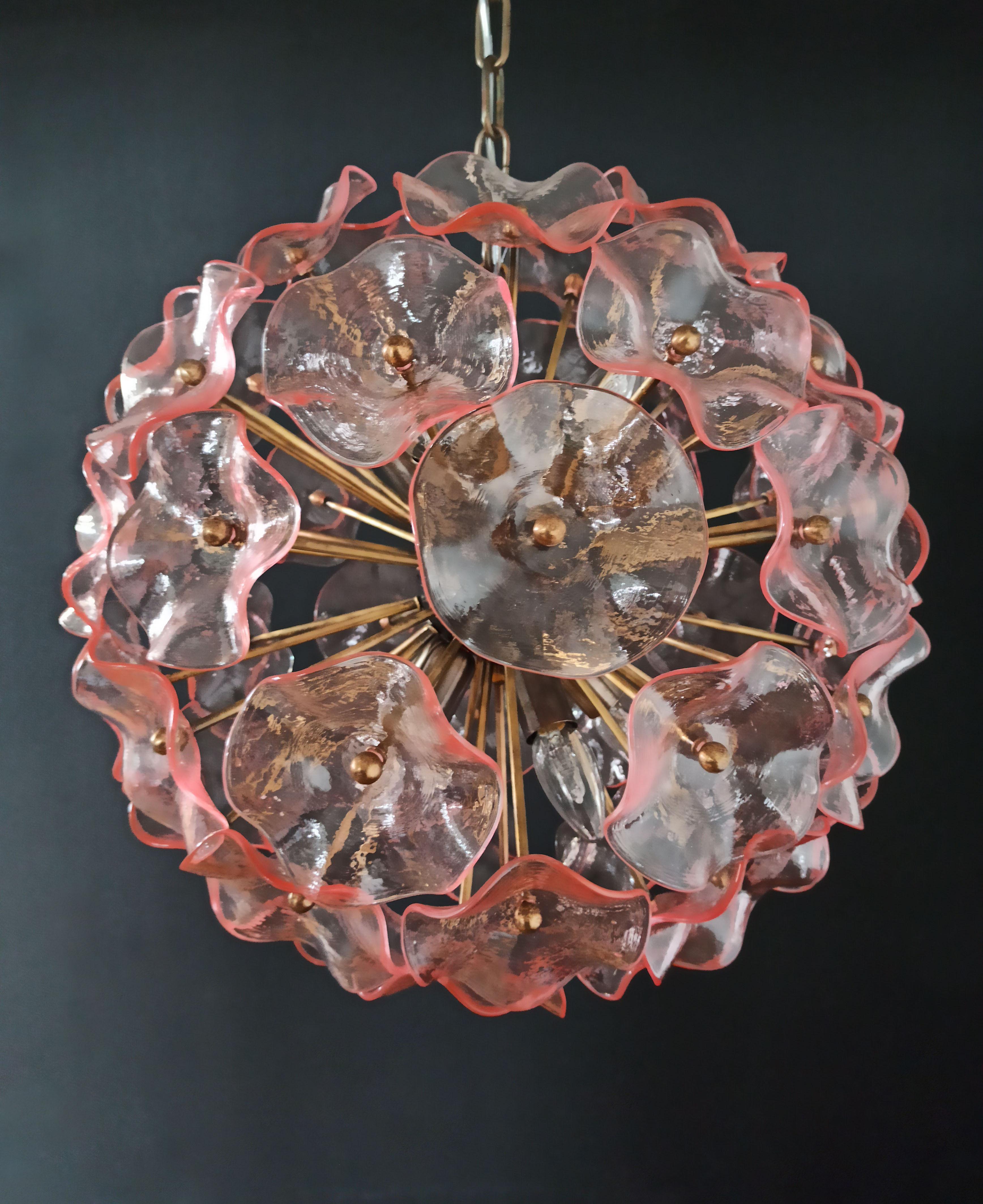 Sputnik space age Italian vintage crystal chandelier made by 51 pink crystals in a burnished brass metal frame.
Period: 1970s-1980s
Dimensions: 41.30 inches (105 cm) height with chain, 17.70 inches (45 cm) height without chain, 19.70 inches (50