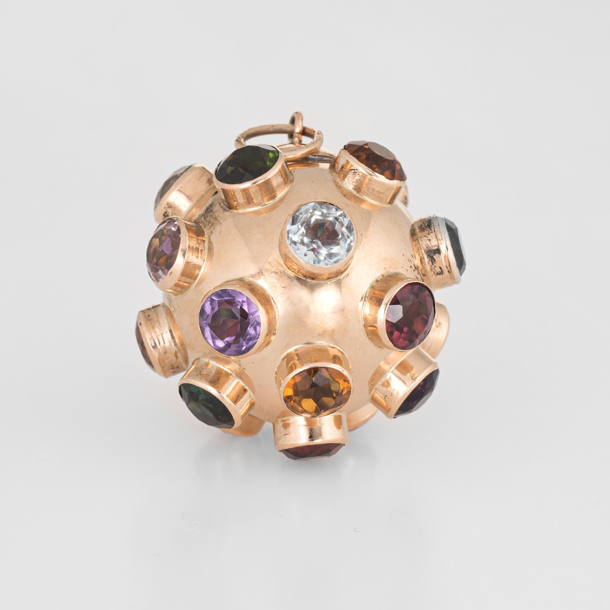 Ornate sputnik gemstone pendant (circa 1950s to 1960s) crafted in 18 karat yellow gold. 

Multi semi-precious gemstones are uniform in size each measuring 5mm (0.25 carats each). The stones include: amethyst, blue topaz, citrine and green & pink