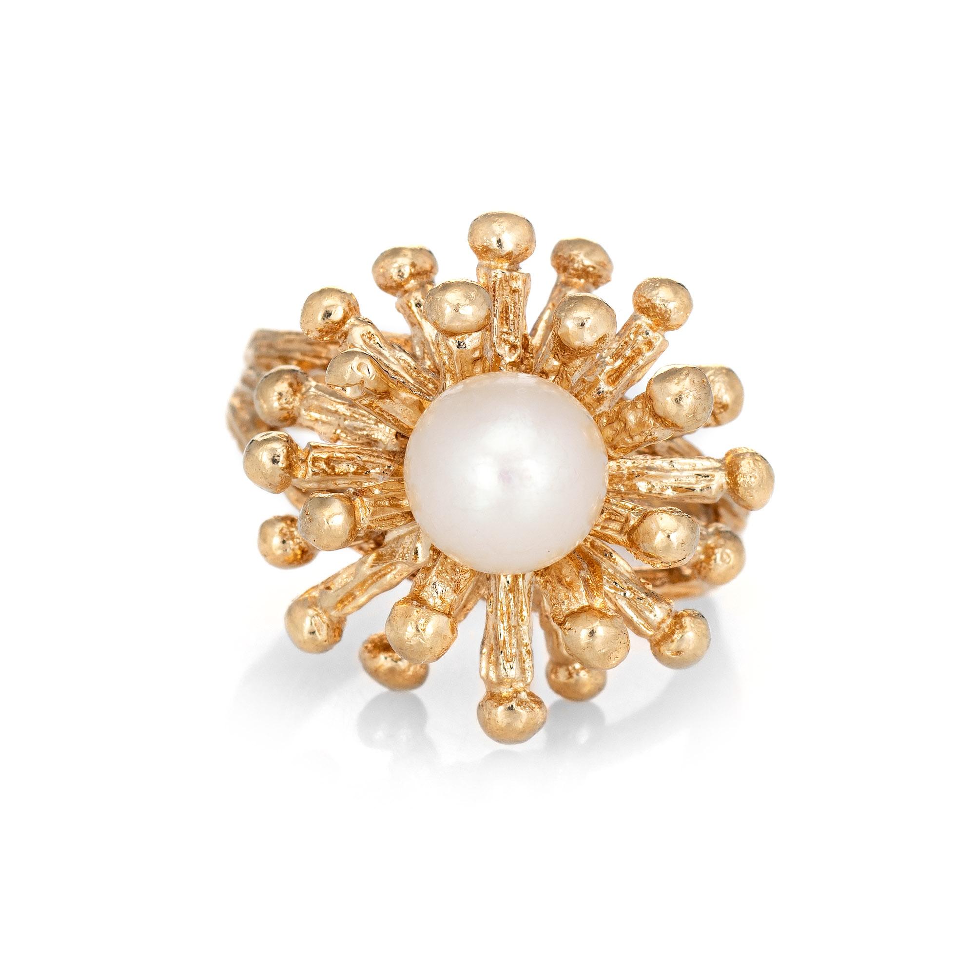 Stylish vintage cultured pearl Sputnik ring (circa 1960s to 1970s) crafted in 14 karat yellow gold. 

Cultured pearl measures 7mm (in excellent condition and free of cracks or chips). 

The cultured pearl is perched in the distinct Sputnik mount.