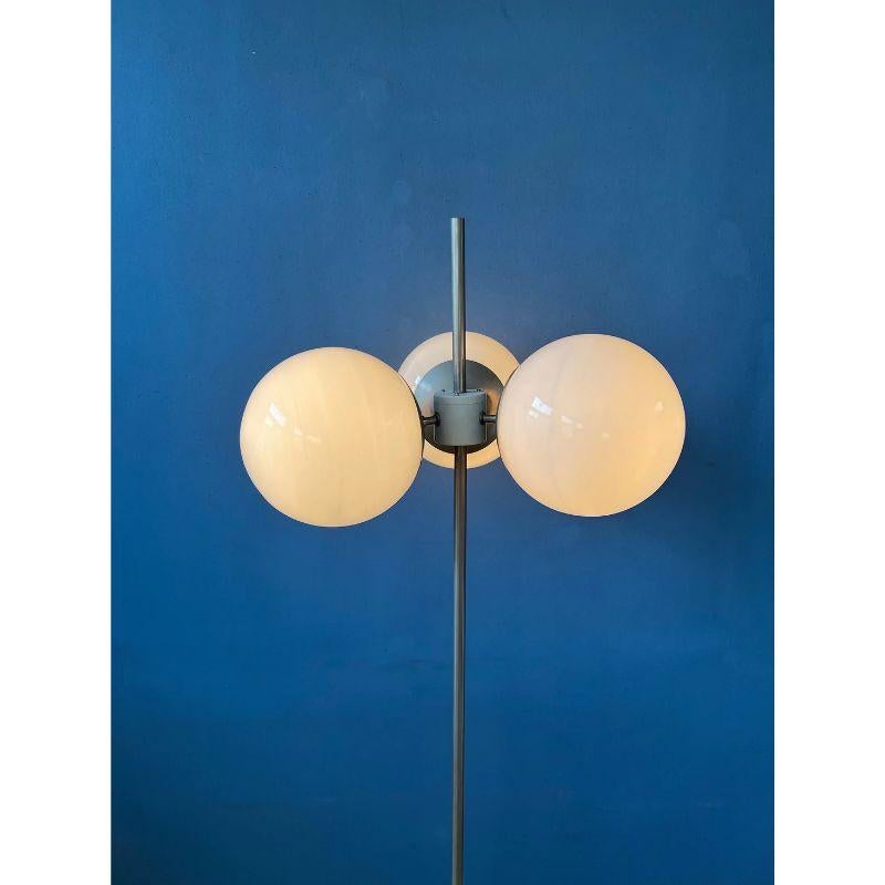 A very rare sputnik floorlamp with three glass shades. The precise brand of the lamps is unknown to us. The shades produce a magnificent, classic light. The lamp requires three E27 lightbulbs and currently has an EU-plug.

Dimensions:
ø Shade: 17