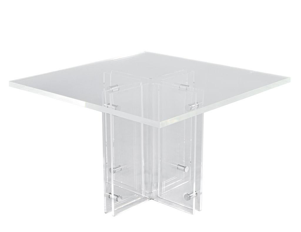 This vintage square acrylic games table, made in France circa 1970's, is the perfect addition to any modern home. With thick solid acrylic construction, this table features a curved pedestal with stainless steel accents, giving it an elegant and