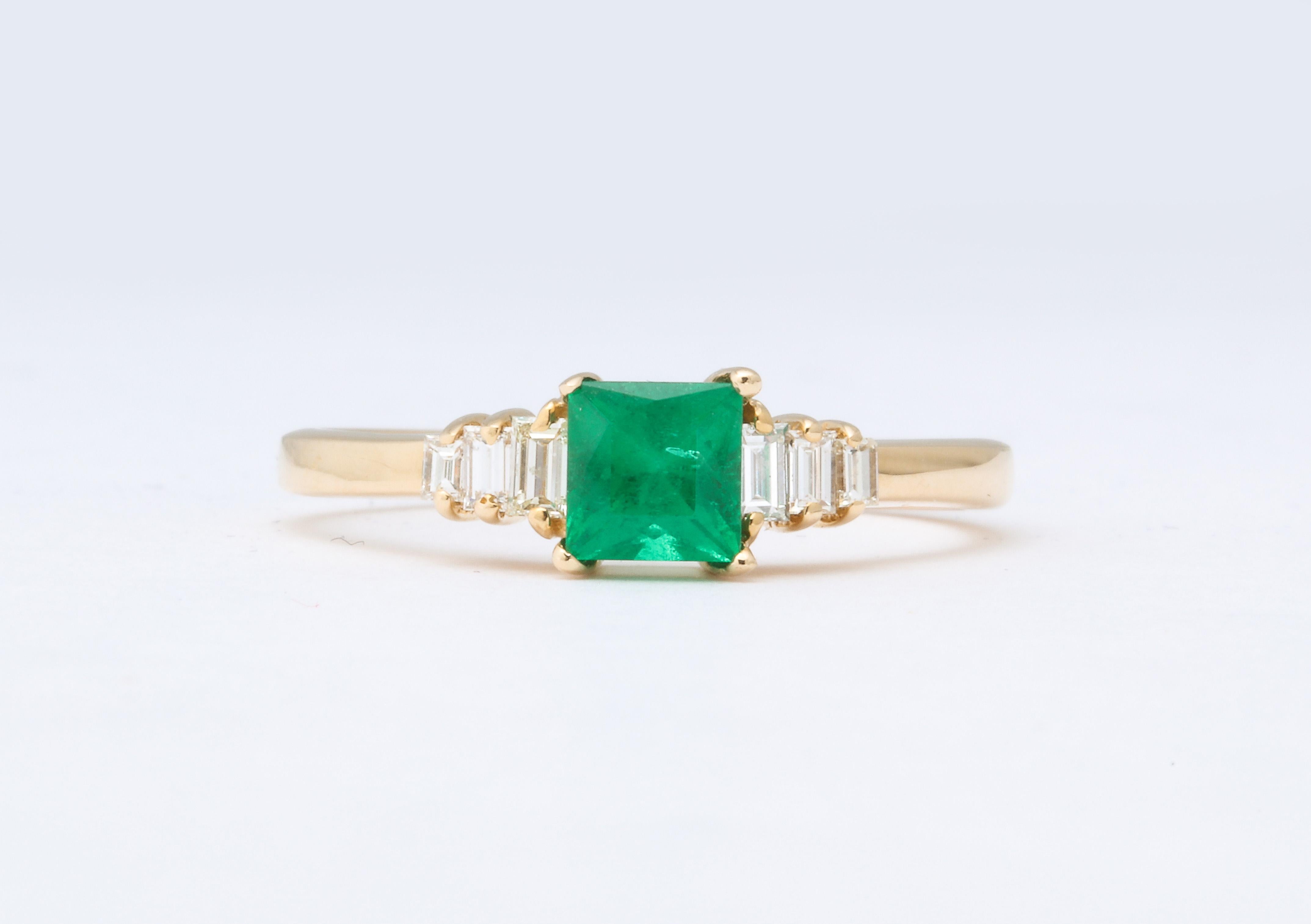 This vintage square cut Emerald is a .75 ct natural Columbian Emerald with three fine quality baguette diamonds flanking each side.  It is set in 14K gold .It is a classic engagement  or for any occasion.