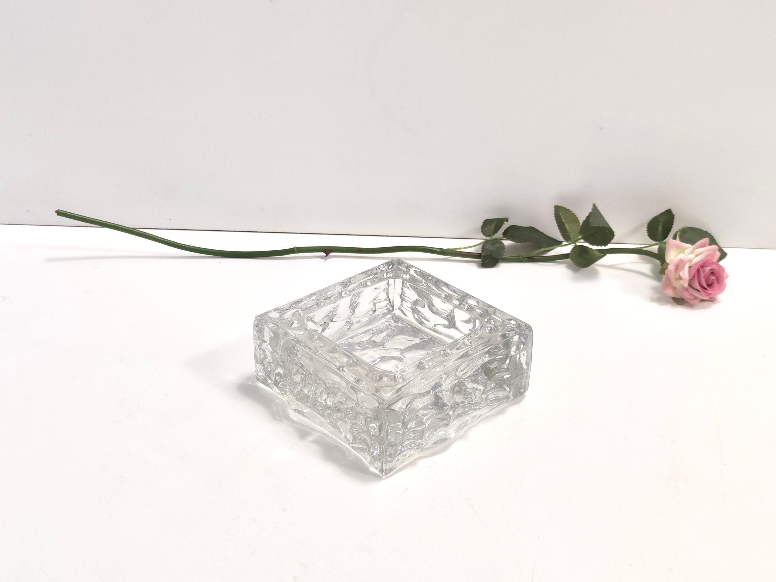 Made in Italy, 1968.
Made in thick molded glass. 
It is a vintage piece, therefore it might show slight traces of use, but it can be considered as in perfect original condition and ready to become a piece in a home. 

Measures: 
Width: 15 cm 
Depth: