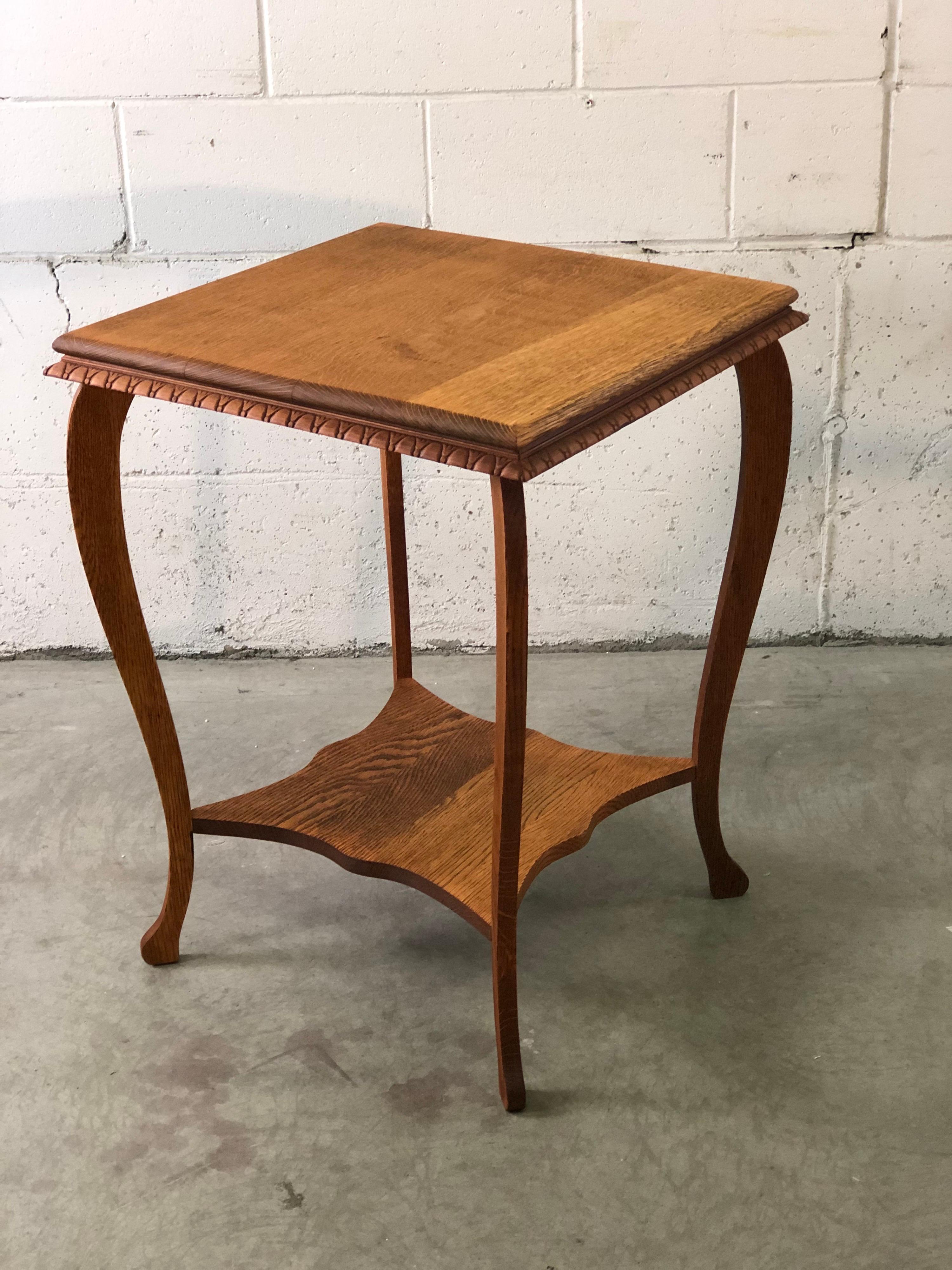 Vintage square oak wood side table with nice edge details and curved legs. A second shelf for additional storage. No marks.
