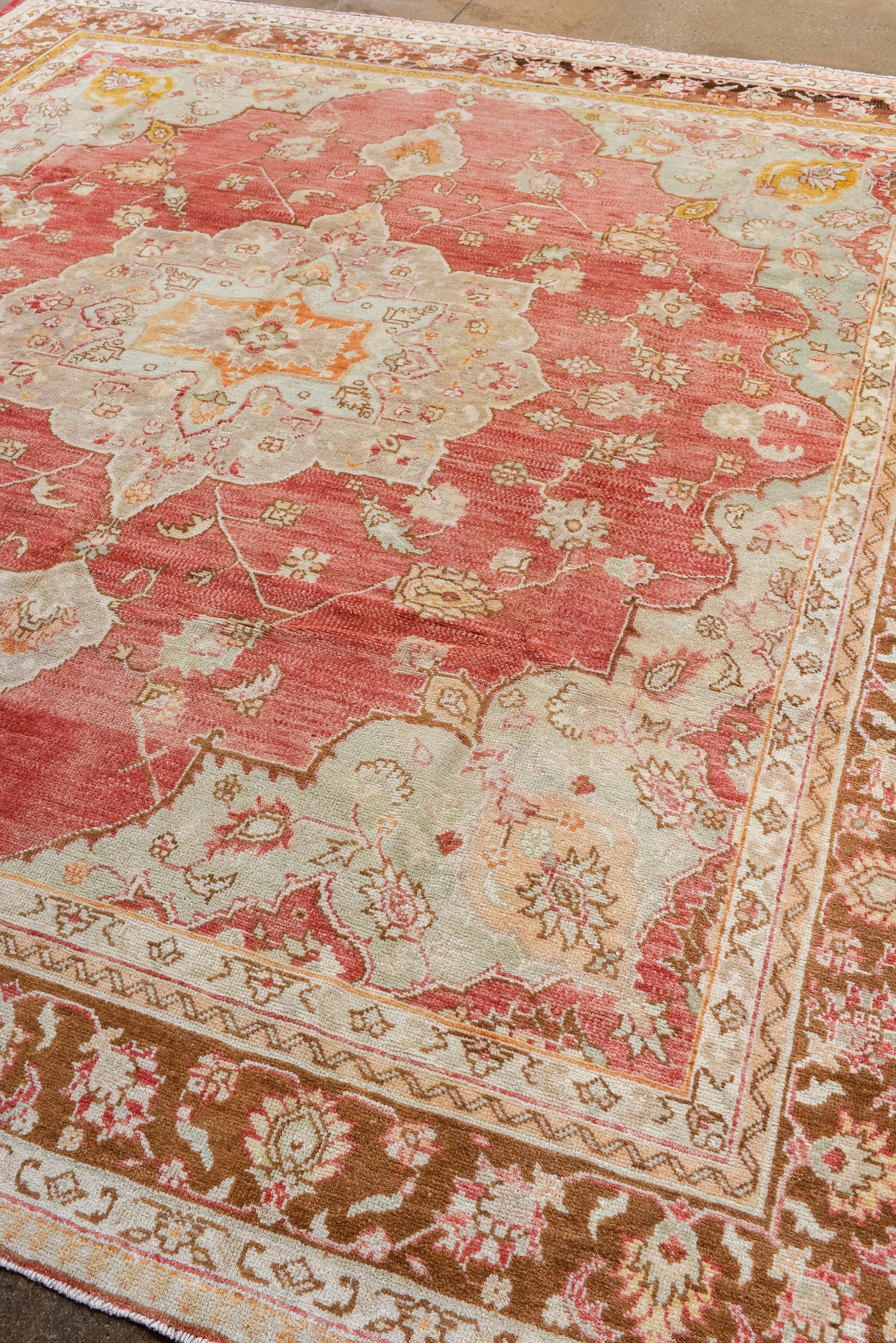 Turkish Vintage Square Oushak with a Rust Red Field and an Ecru Medallion For Sale