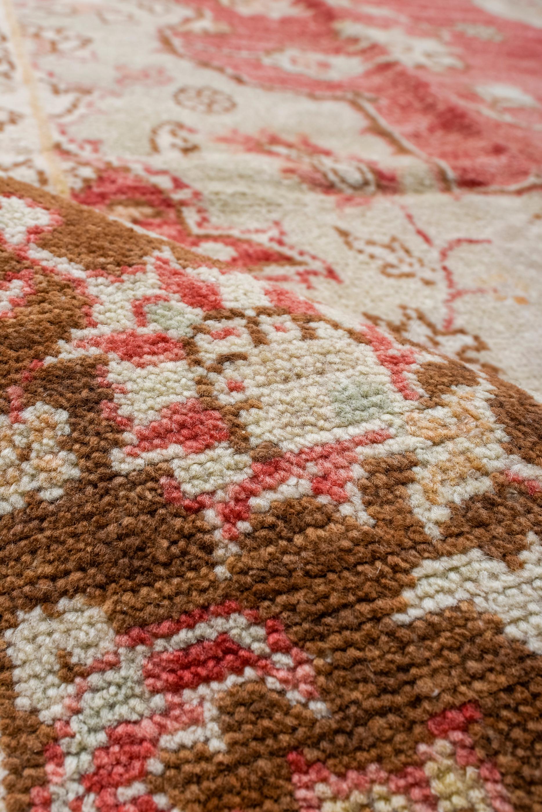 Wool Vintage Square Oushak with a Rust Red Field and an Ecru Medallion For Sale