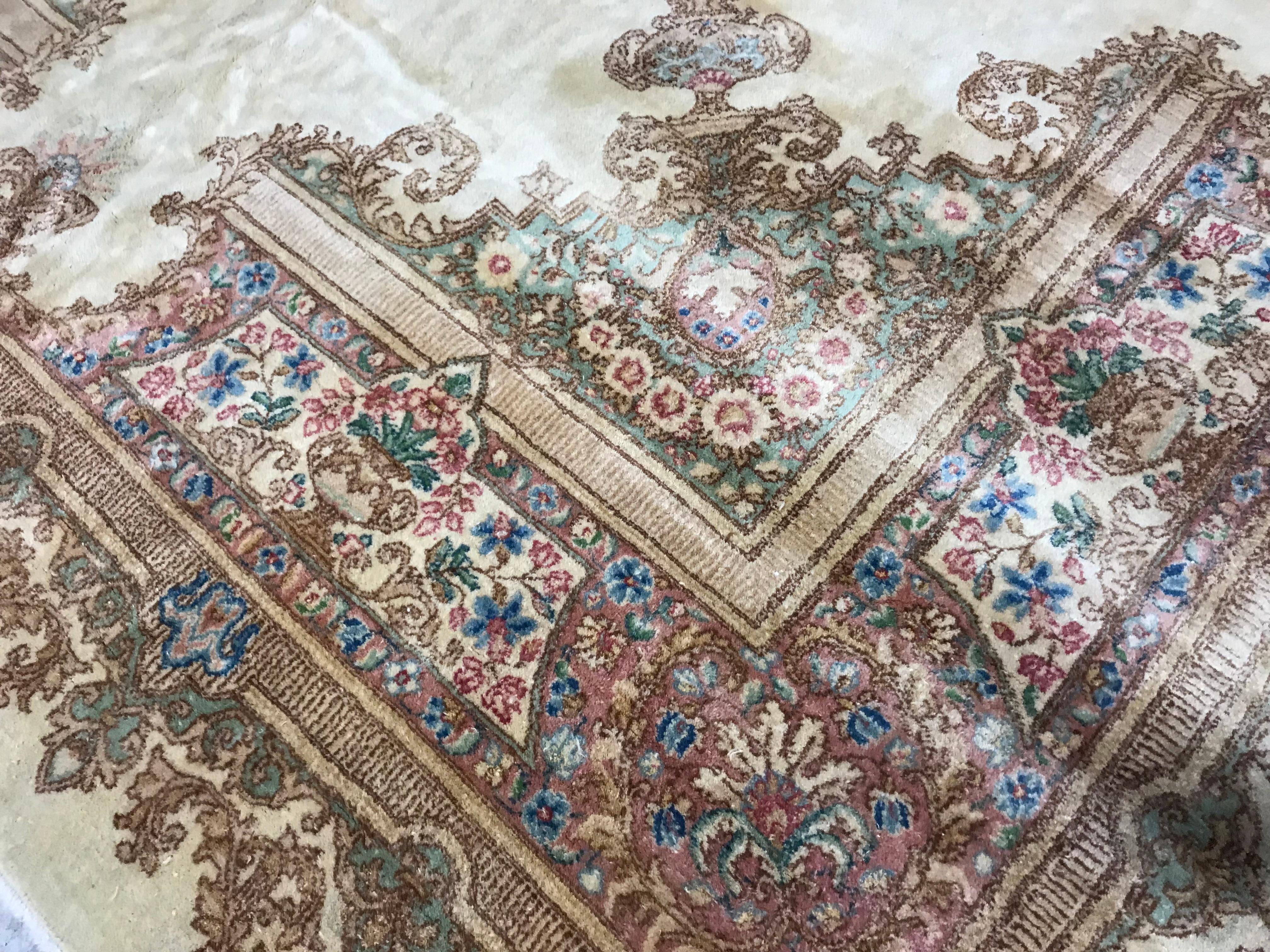 Vintage Square Persian Kerman Rug circa 1940. A wonderful square Kerman rug with an ivory ground having a central medallion with the floral theme continuing into the corners and borders of this light and airy piece.