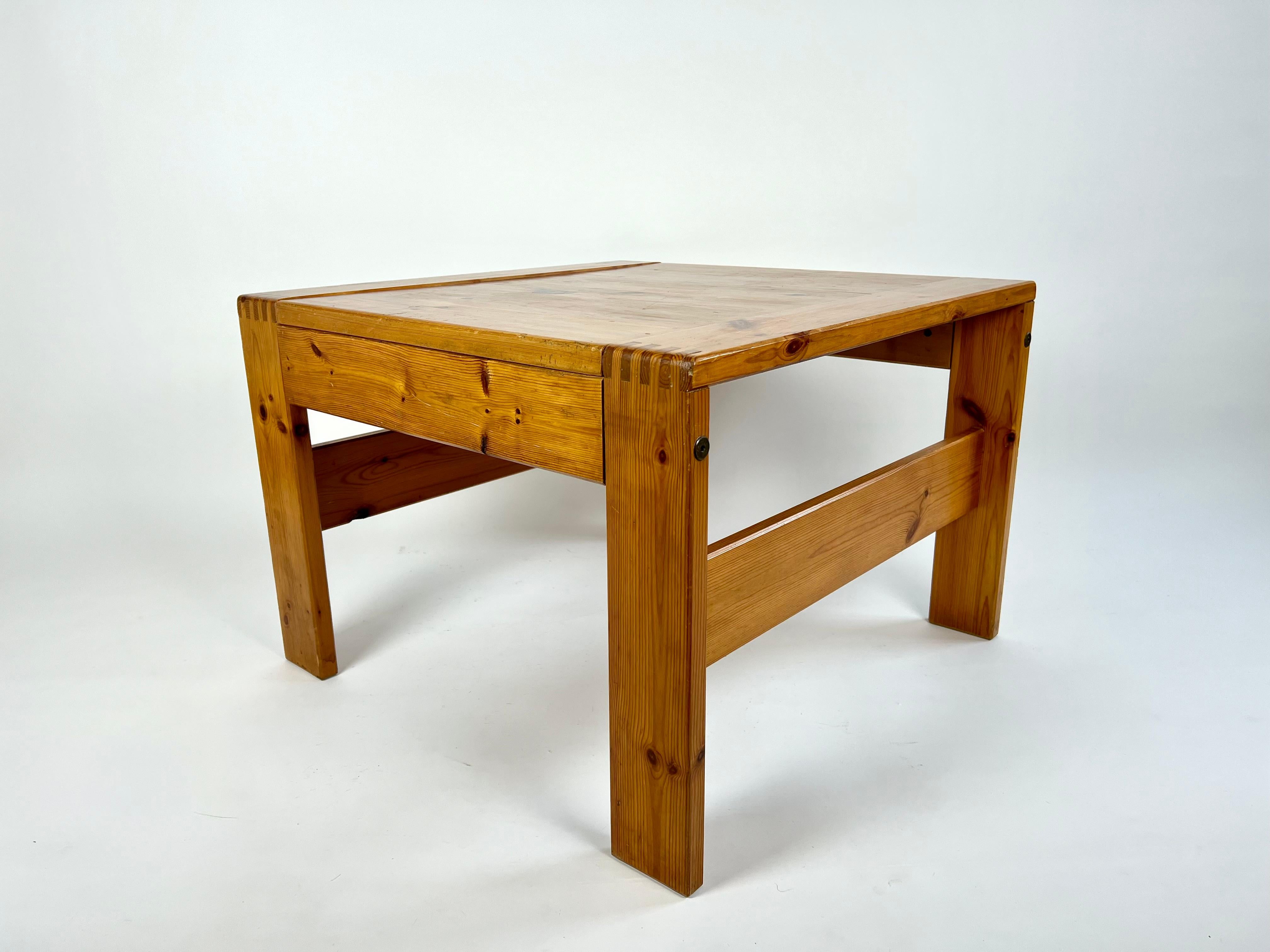 Vintage square coffee table in solid pine from the 70s-80s, sourced from France.

Great wood tone and nice finger joint detailing. The table is in an alpine style  with a clear nod to designs for Les Arcs by Charlotte Perriand.

Well built, solid