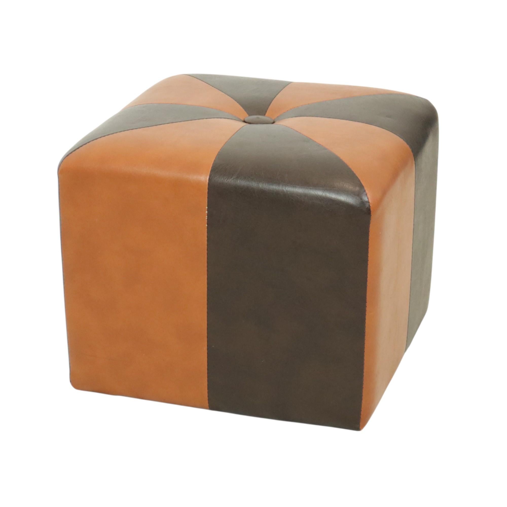 A charming, square, vintage patchwork-style ottoman made from a wooden base and upholstered in high-quality, two-tone brown and camel-colored faux leather, manufactured in Belgium circa the 1960s.

A characterful and authentic object from the 1960s.
