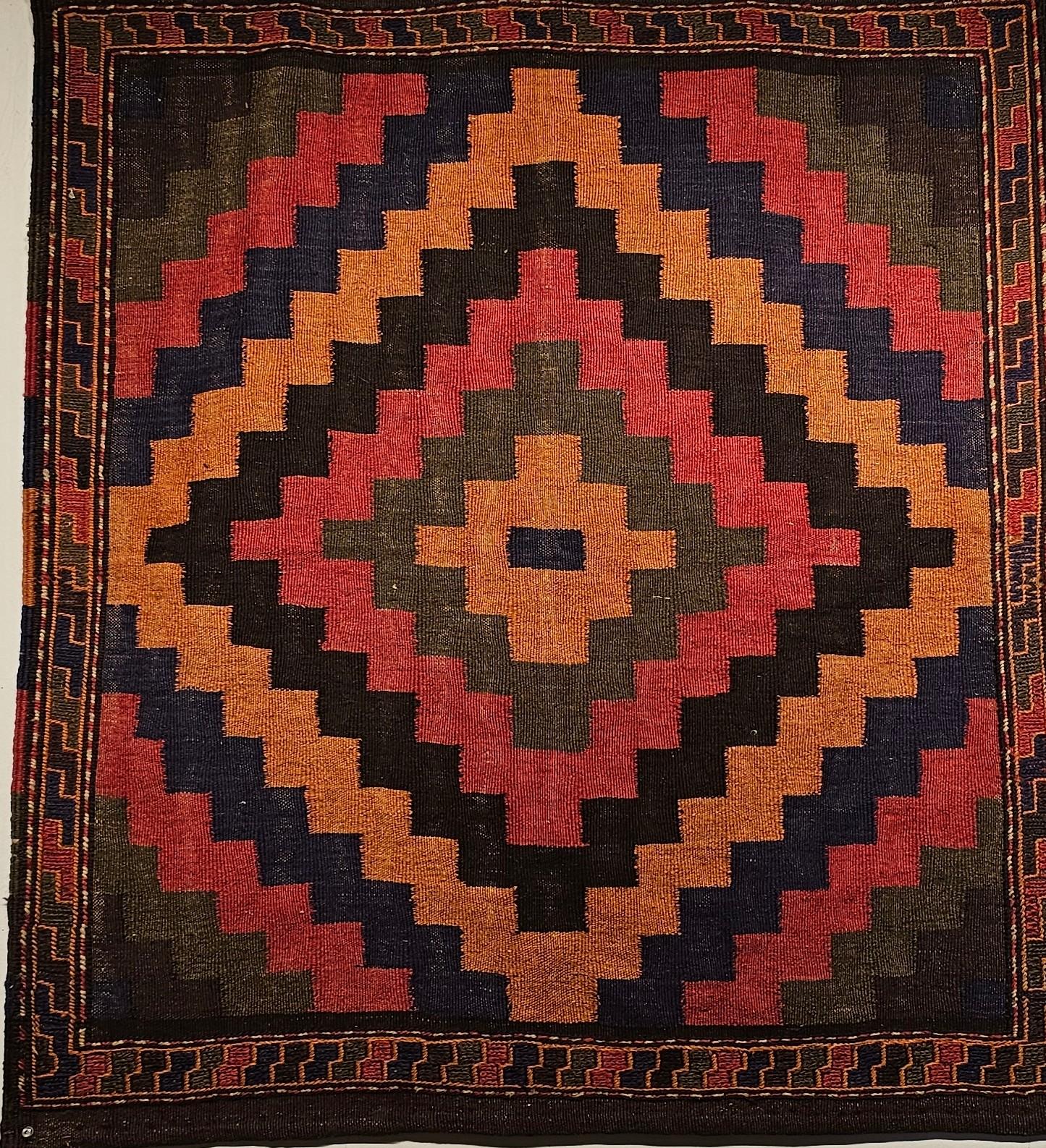 A very rare Persian  sofreh tribal Kilim from the mid 1900s.  The handwoven tribal kilim is from the Qashqai tribes in Southwest Persia.  It is a very desirable square-size tribal kilim with natural organic dyes.  The sofreh kilim was mostly woven